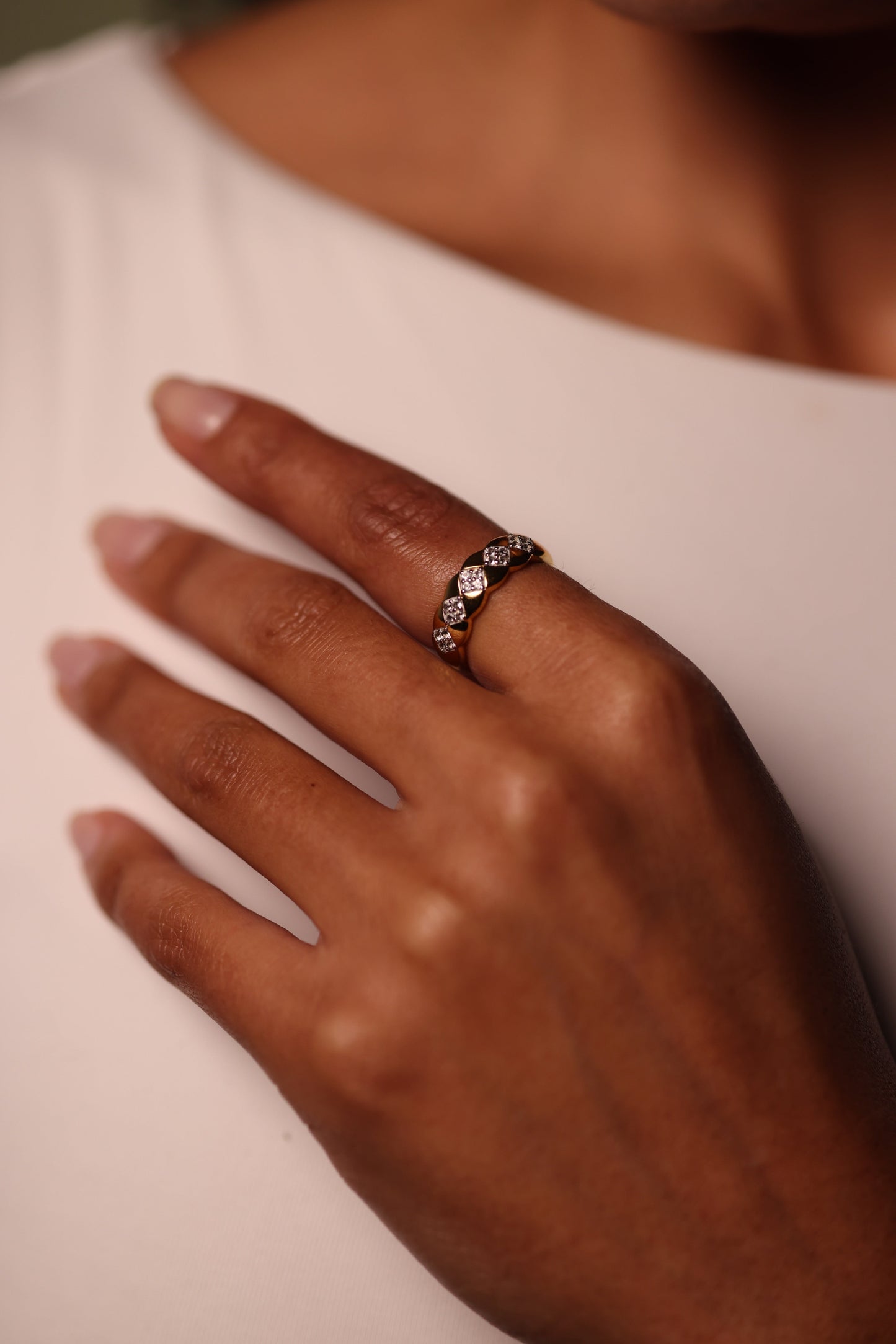 Taal Ring with white topaz stones in a gold band showcasing balanced and modern design