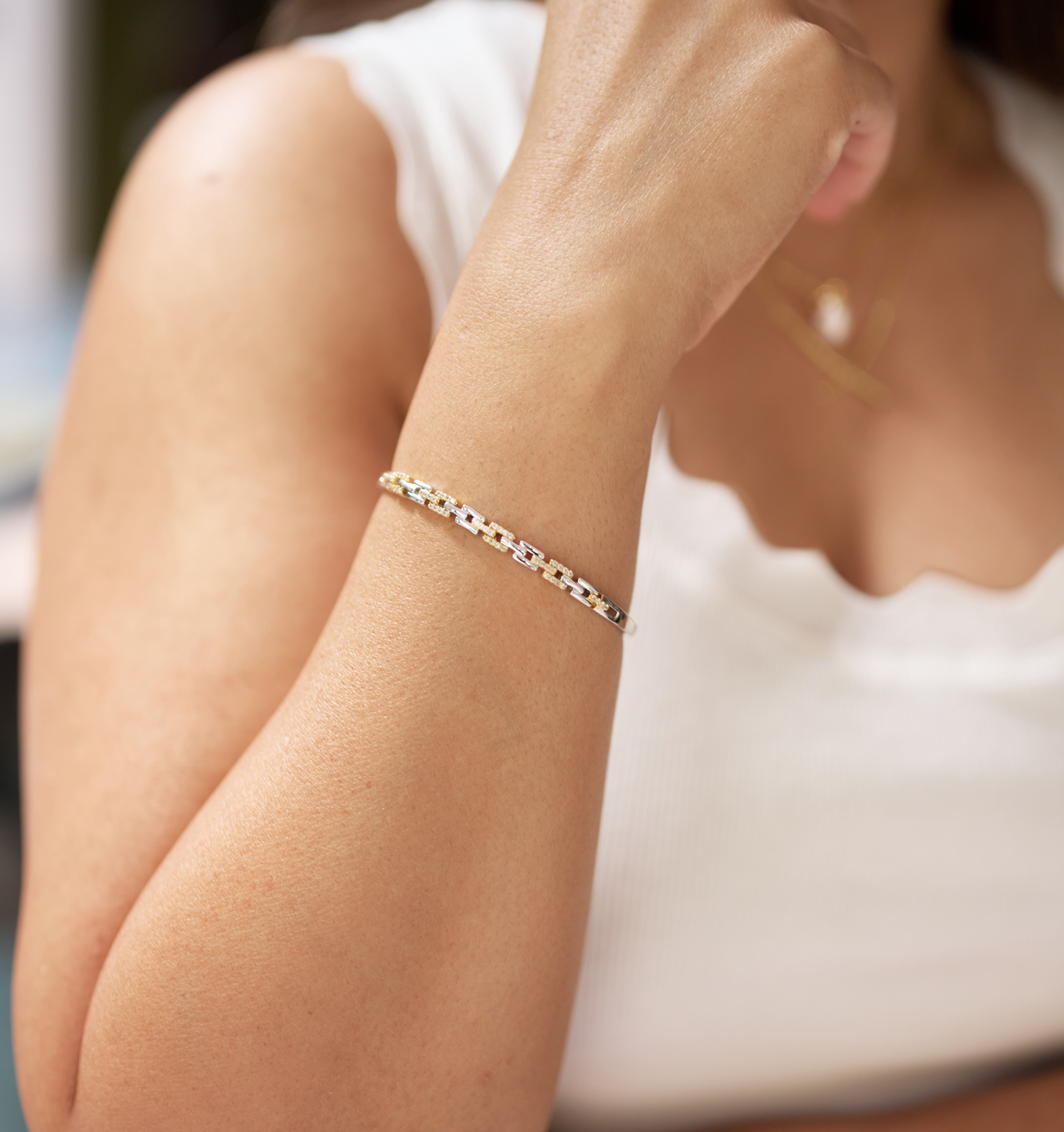 Noura Cuff delicate gold and silver bracelet with 52 sparkling stones on wrist