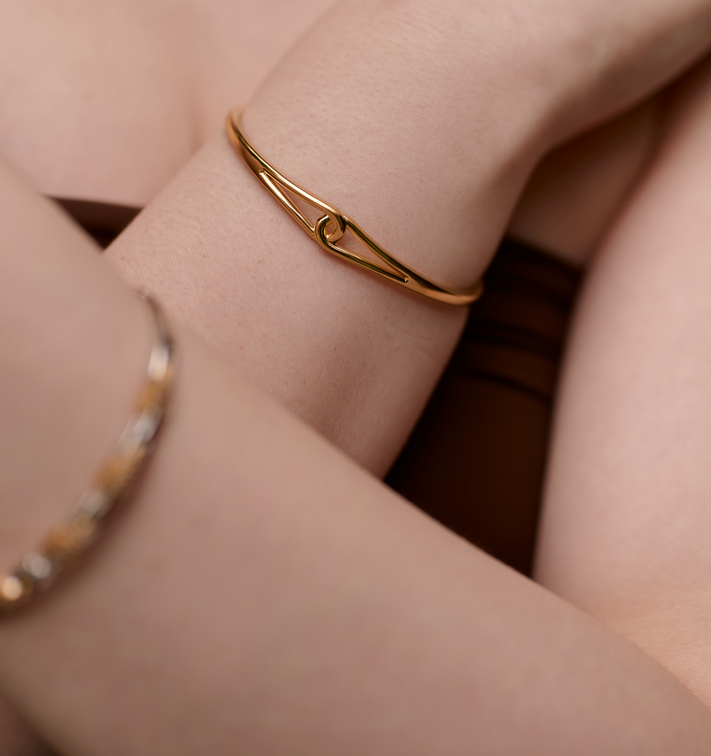 Minimalist gold Vetra Cuff bracelet with clean lines and a fierce focal point worn solo on wrist