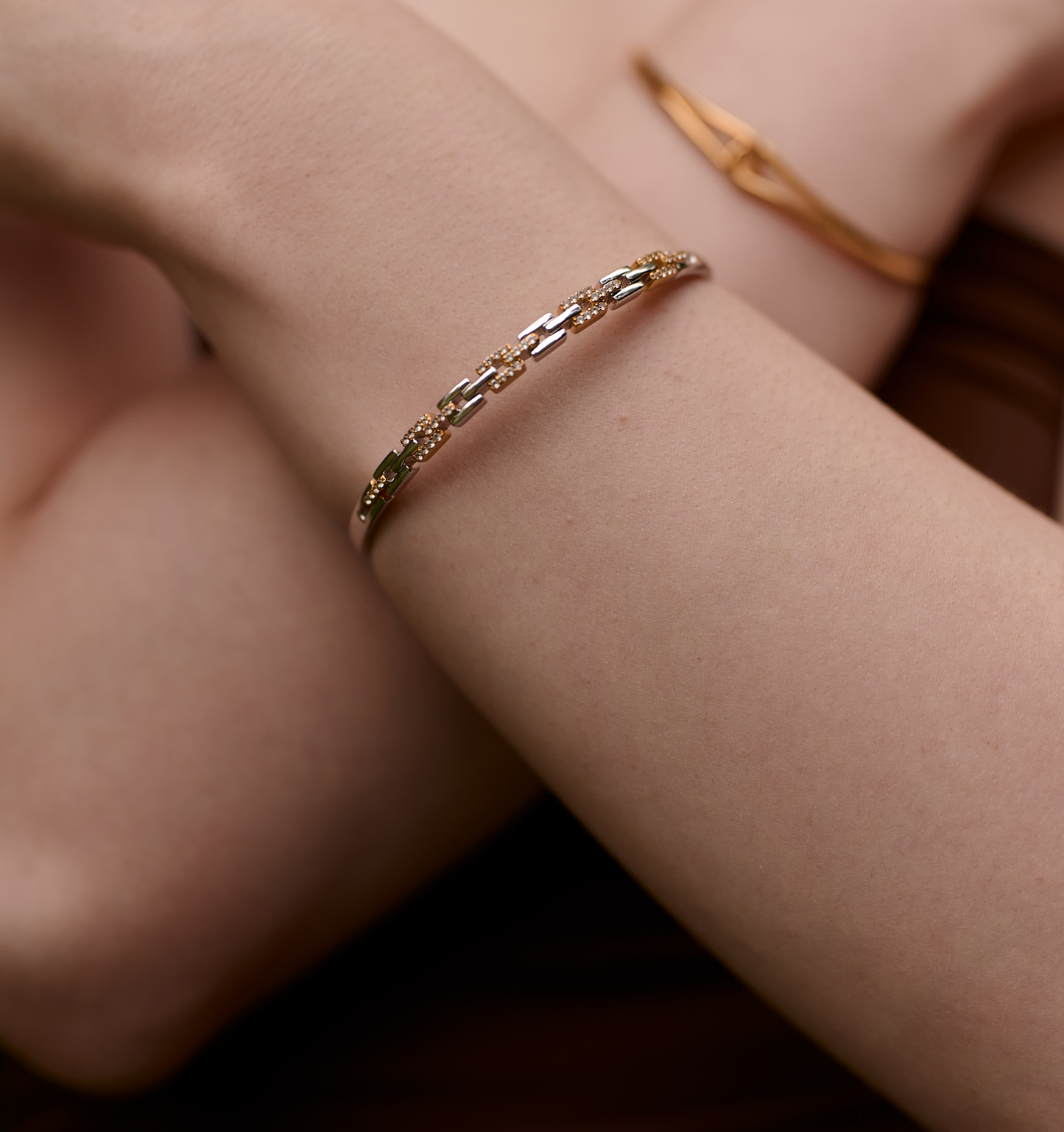 Noura Cuff gold and silver bracelet with 52 sparkling stones on wrist