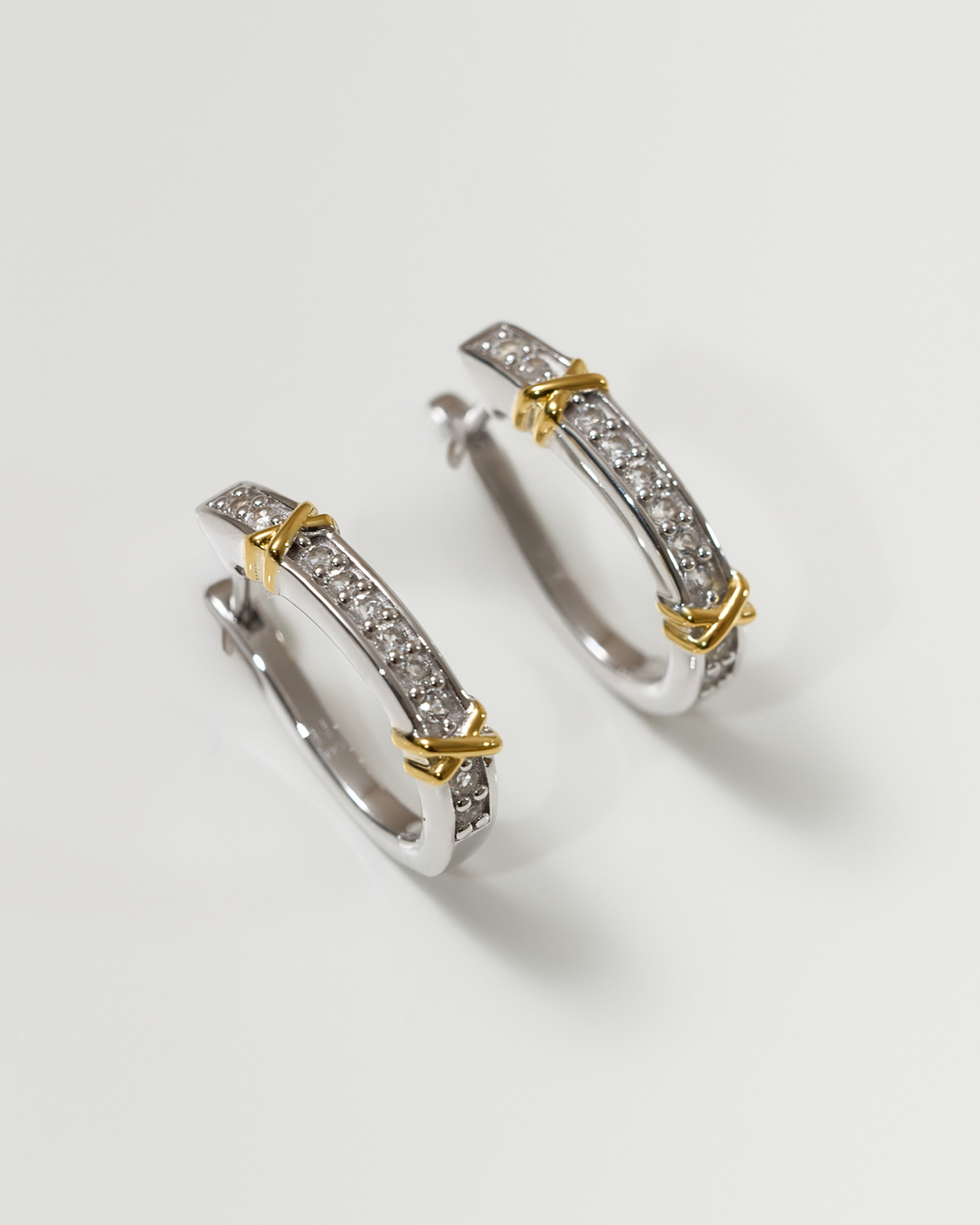 Aarvi Hoops gold earrings with pavé white topaz stones and unique curved design