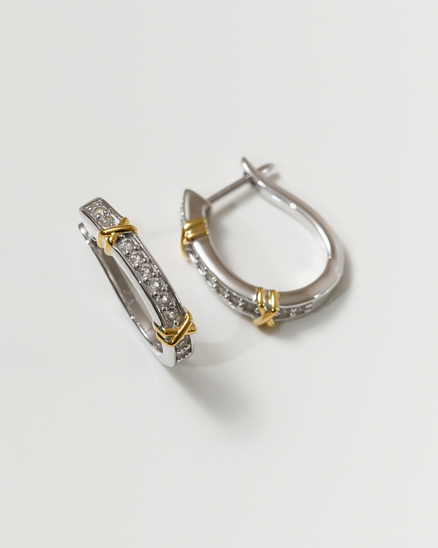 Aarvi Hoops gold and silver curved earrings with pavé white topaz stones