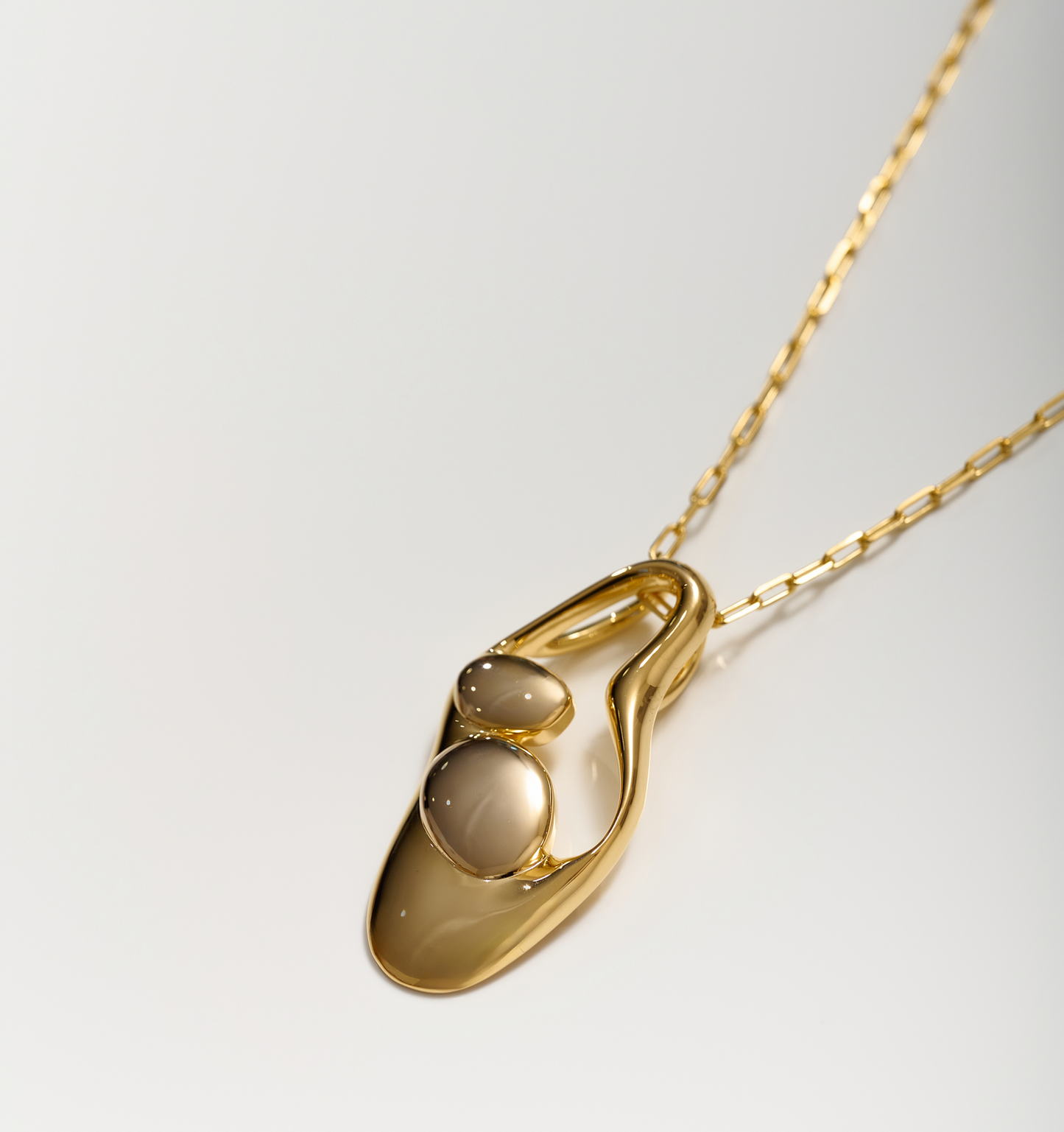 Aakar Necklace fluid gold abstract sculpted pendant on chain