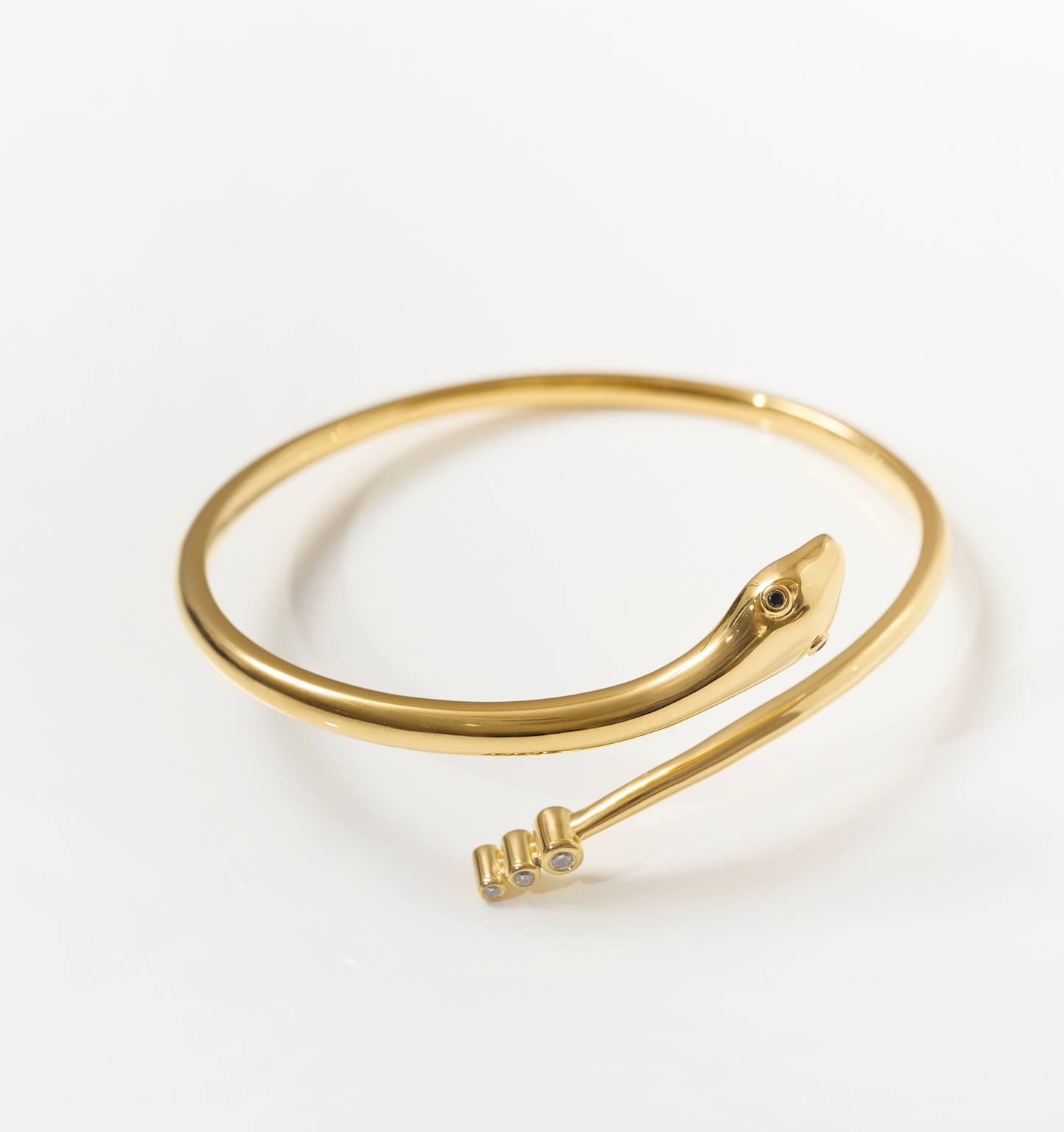 Sarpa Cuff gold serpent bracelet with black spinel eyes and diamond detail