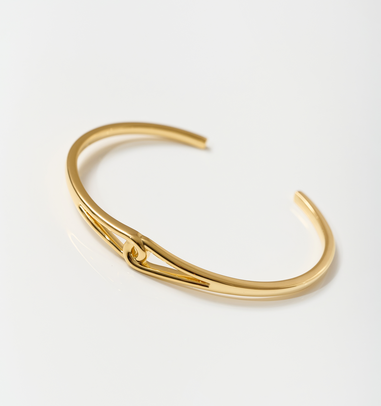 Minimalist gold Vetra Cuff with clean lines and a fierce focal point, designed to be worn solo.