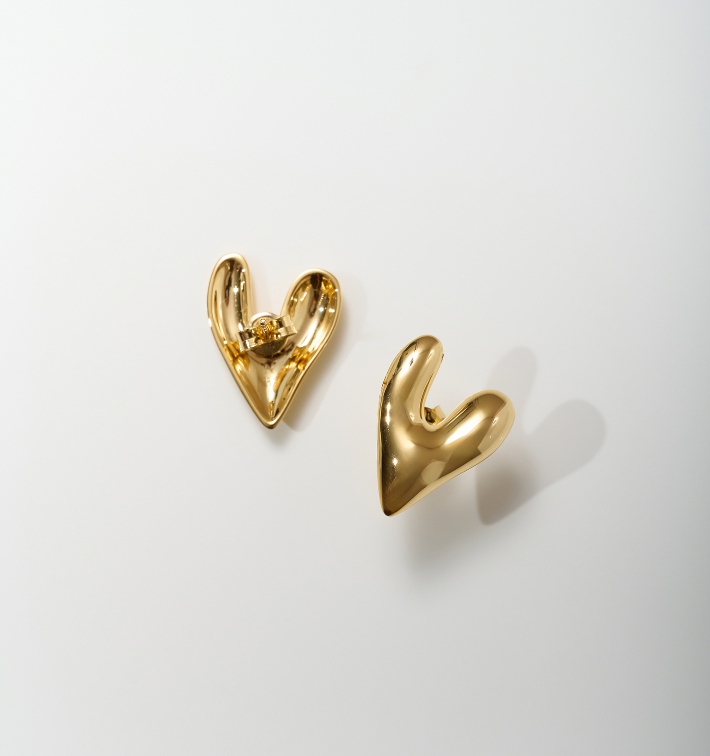 Avara Earrings gold-toned silver heart-shaped sculptural studs with raw organic finish