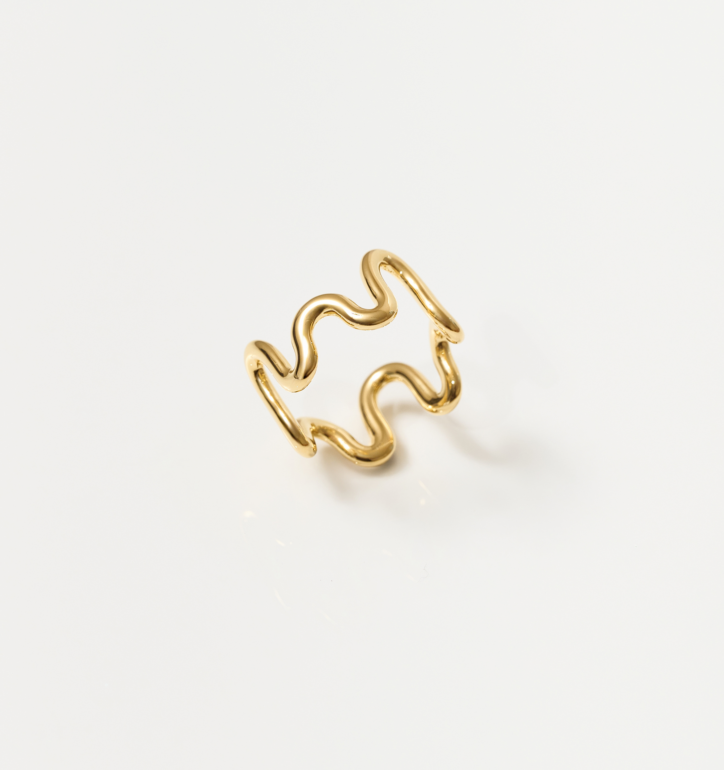 Gold Neer Ring with wavy ripple design inspired by water motion