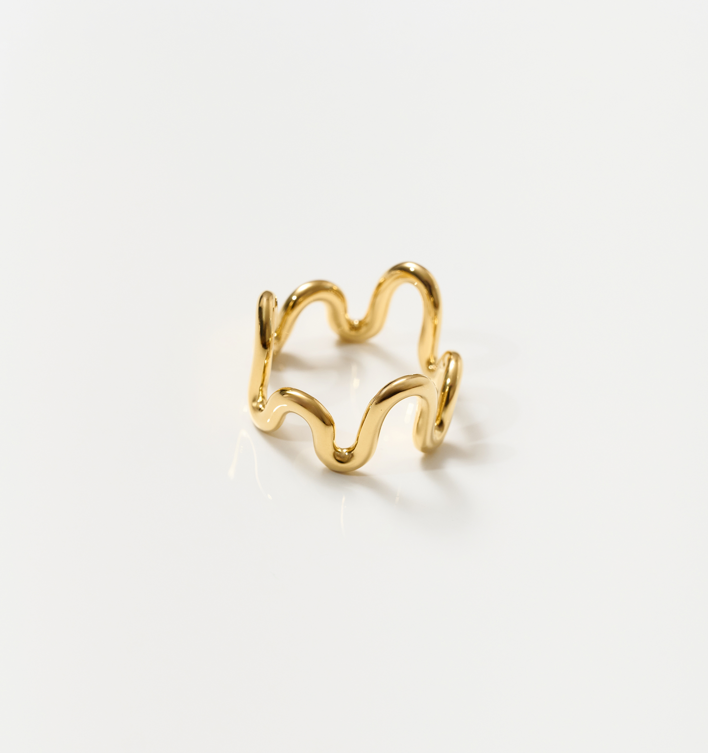 Neer Ring gold ripple design jewelry shaped like frozen water curve