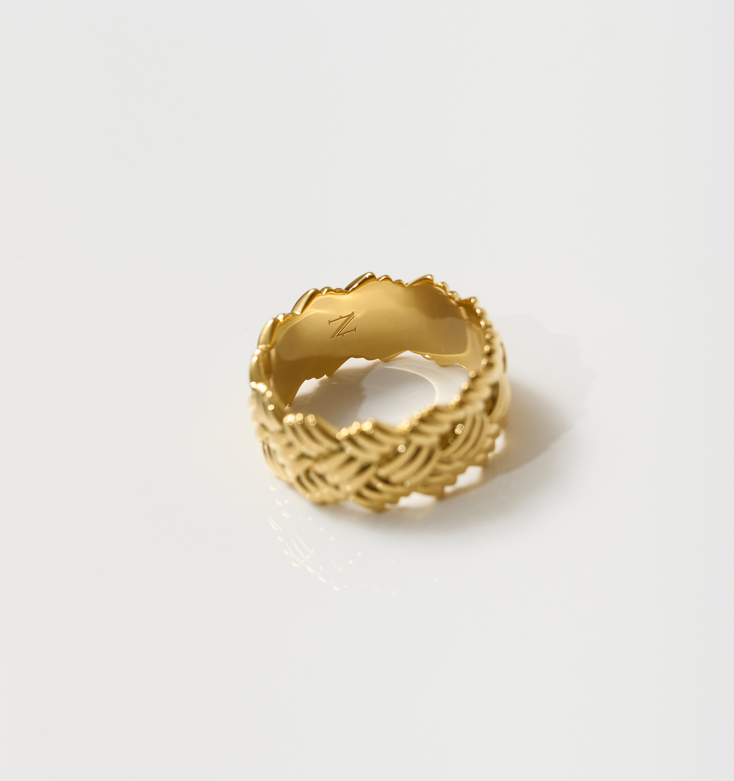 Kaari Ring gold band with intricate woven design showcasing artisanal craftsmanship