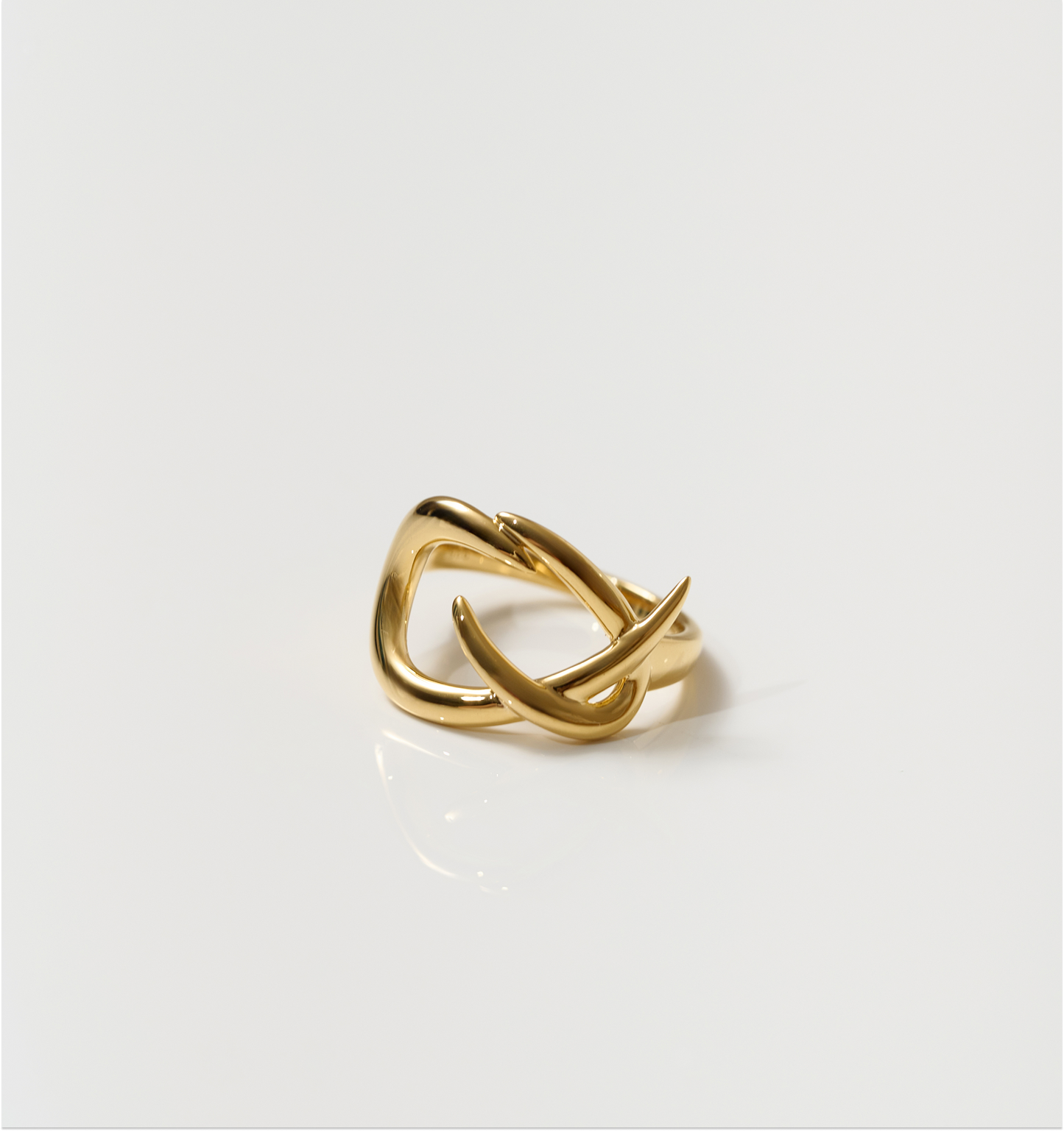 Karvat Ring elegant gold sculpted ring with intertwined curved design symbolizing shifts and power