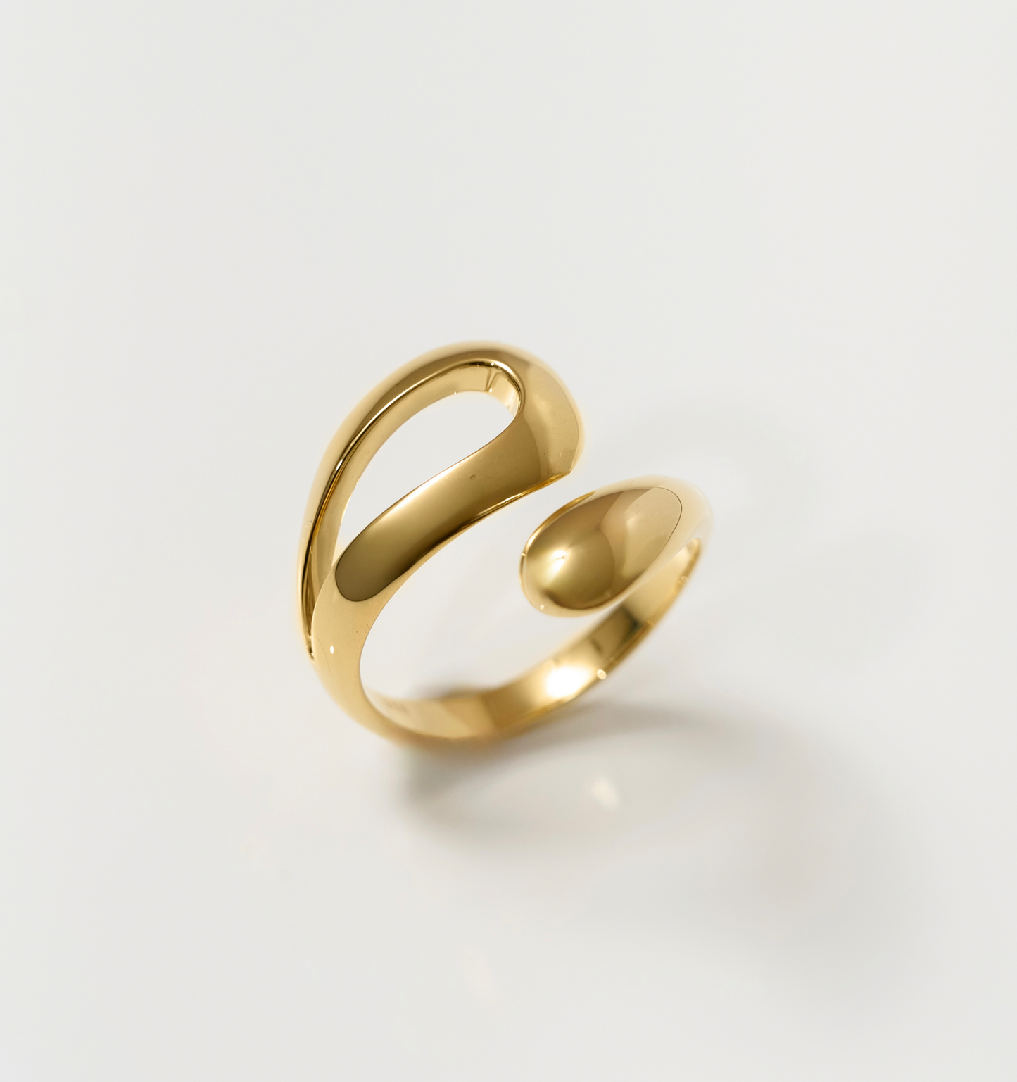 Elegant gold Oriya Ring with smooth spiral design for women