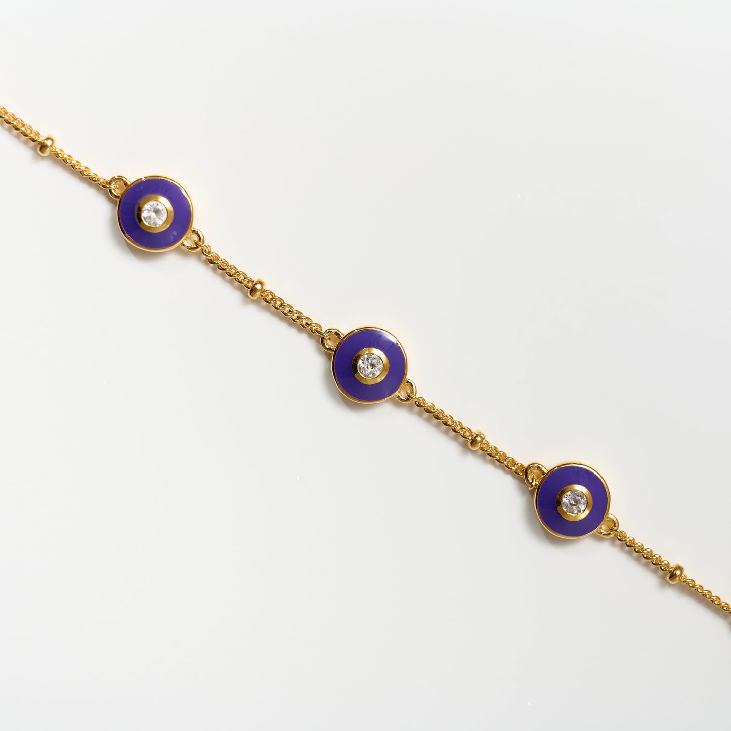 Viraah Bracelet with violet enamel and white topaz on gold chain