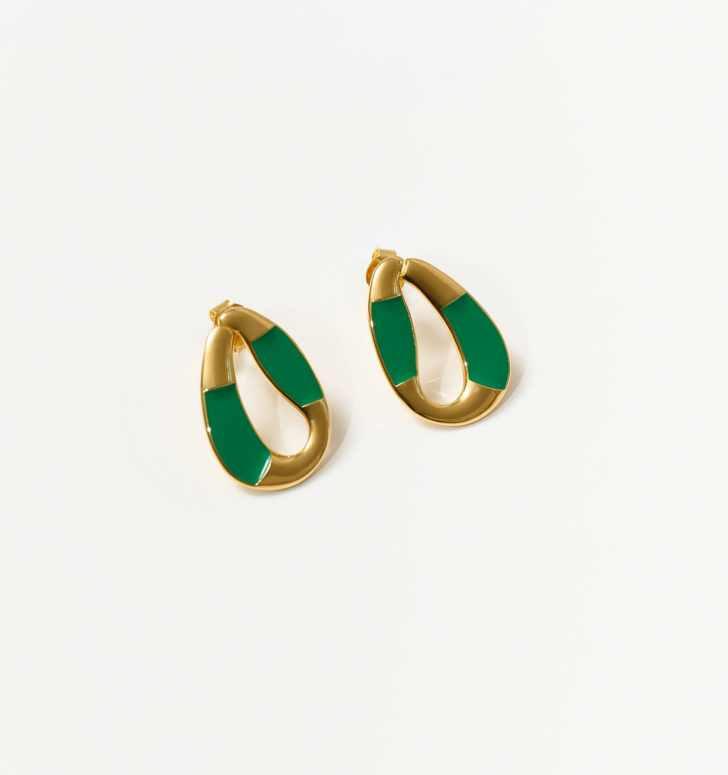 Vana Loop gold earrings with forest green enamel, inspired by nature's rhythm and strength