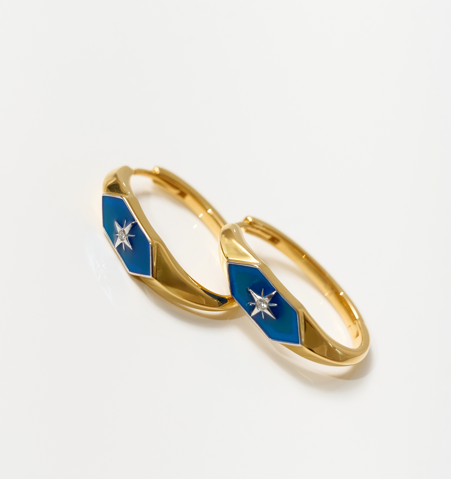 Gold Lumira Hoops with blue enamel and star design detail