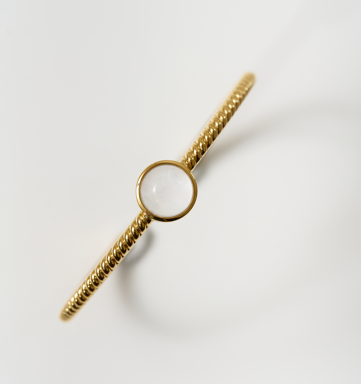 Tarini Cuff gold bracelet with round moonstone centerpiece for balance and intuition