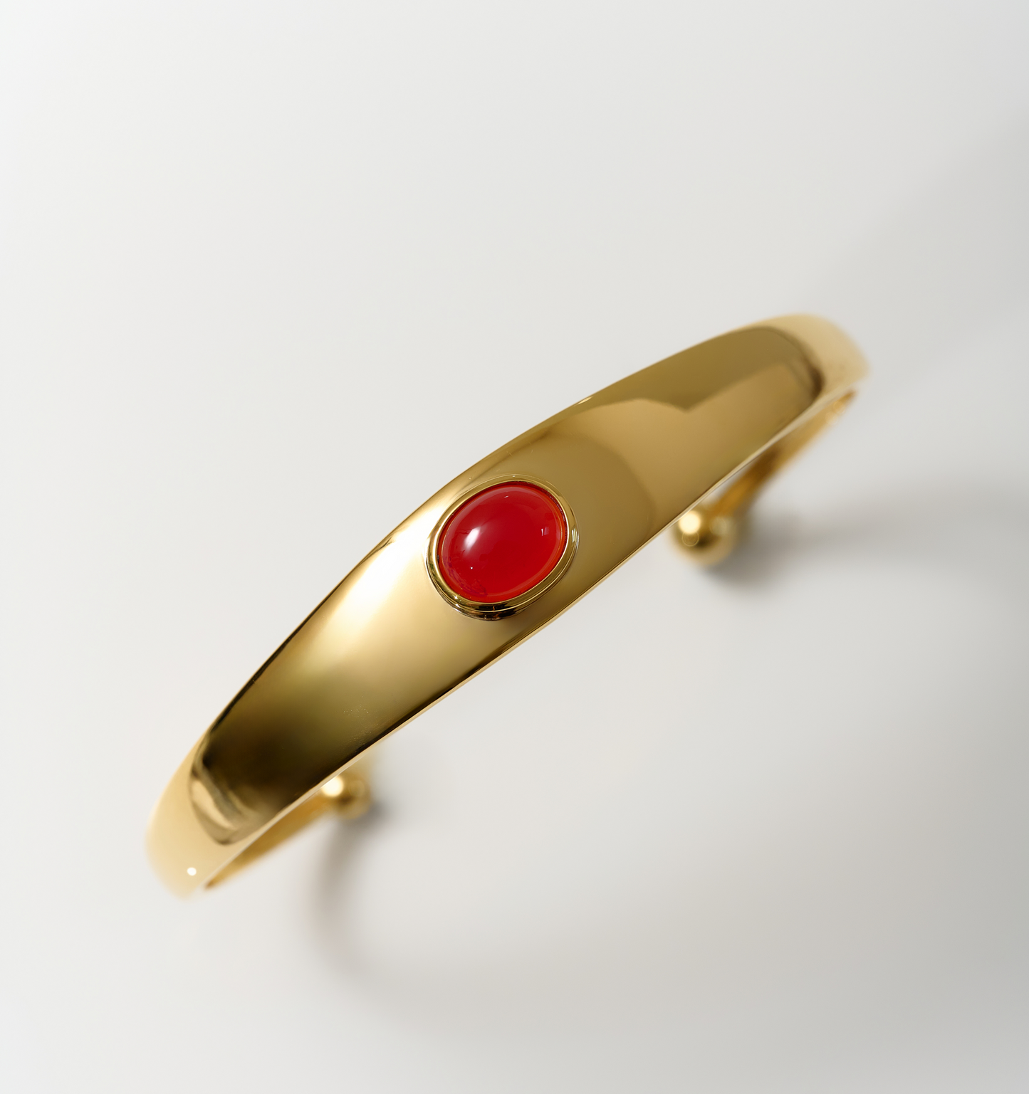 Dhruva Cuff gold bracelet with red onyx stone for grounded courage and energy protection