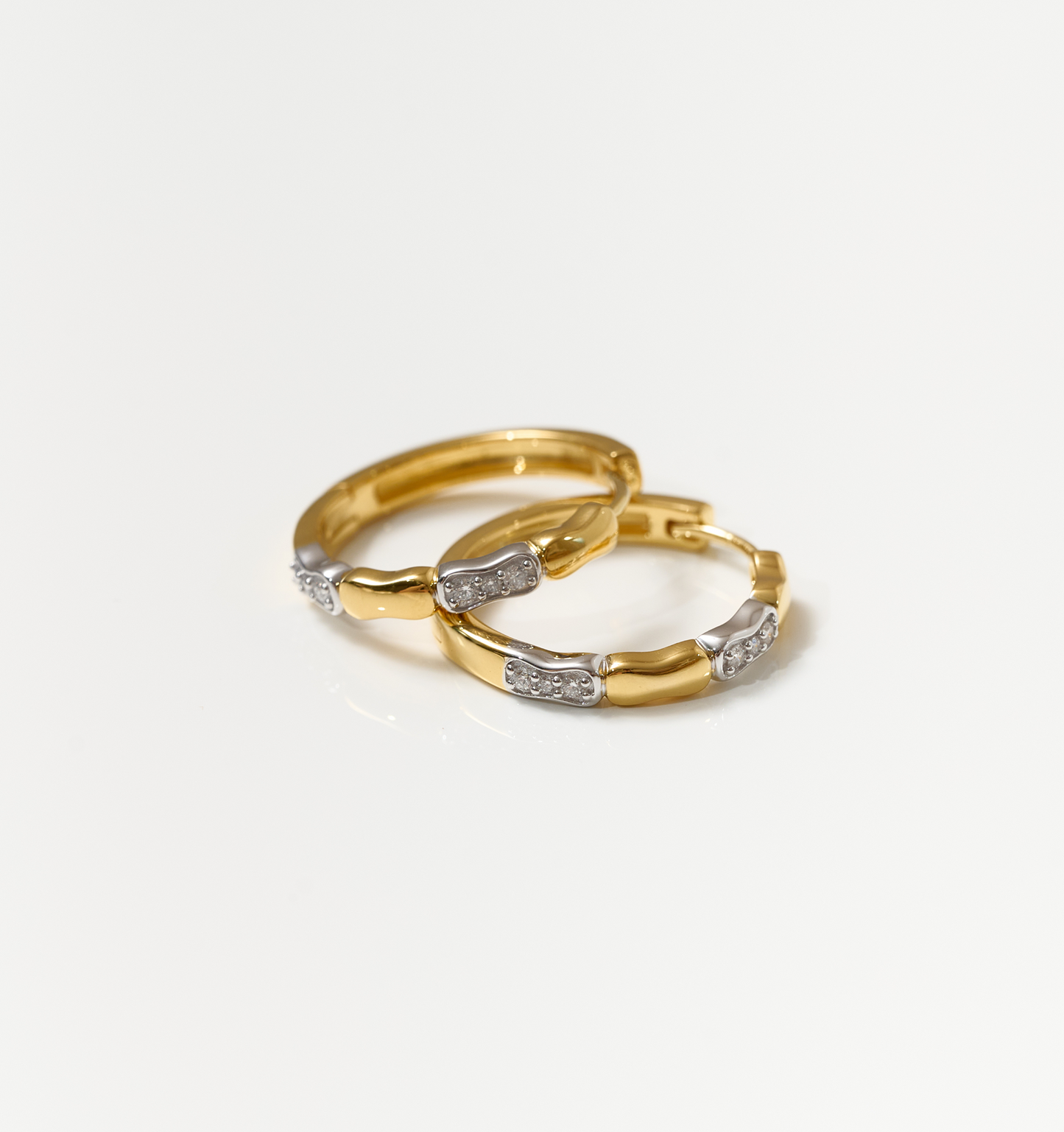 Orita Earrings gold and silver hoop earrings with sparkling stone accents