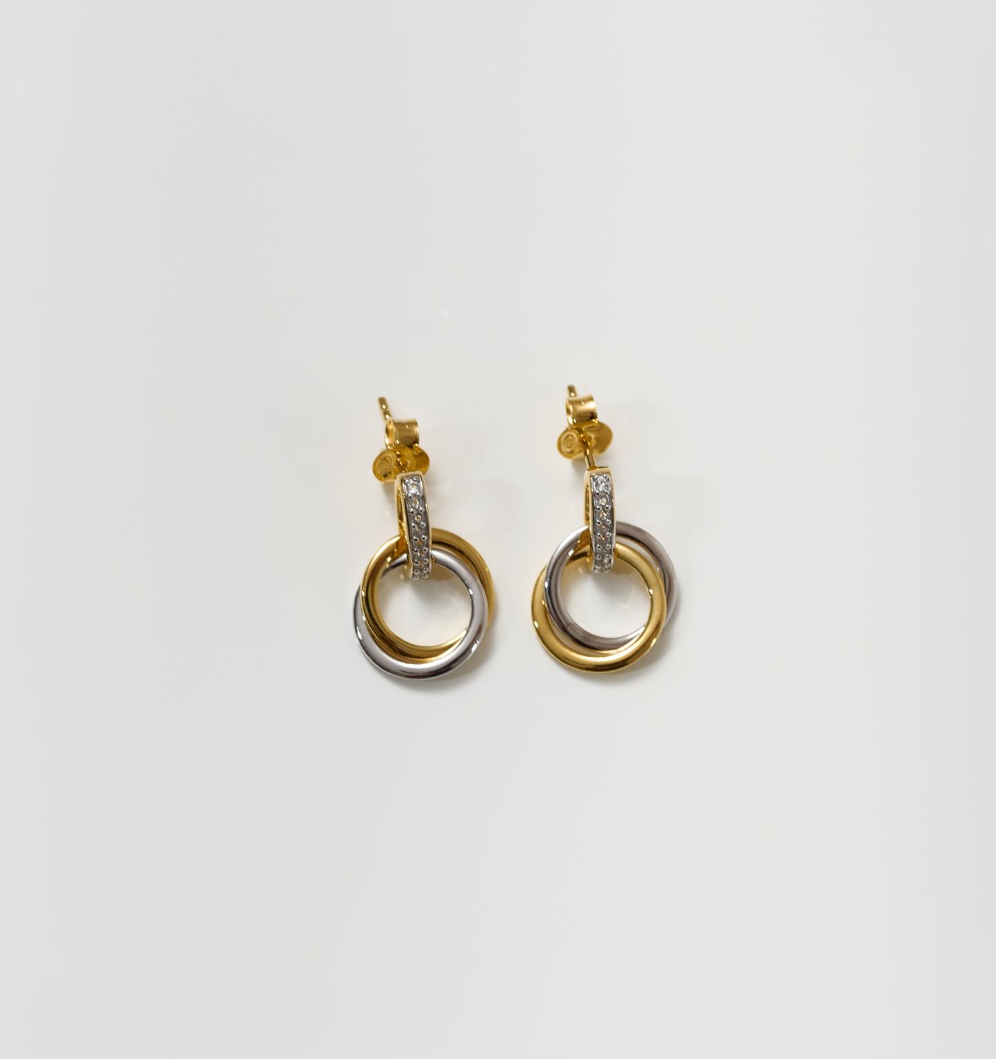 Nirya Earrings gold and silver rings with diamond accents in elegant design