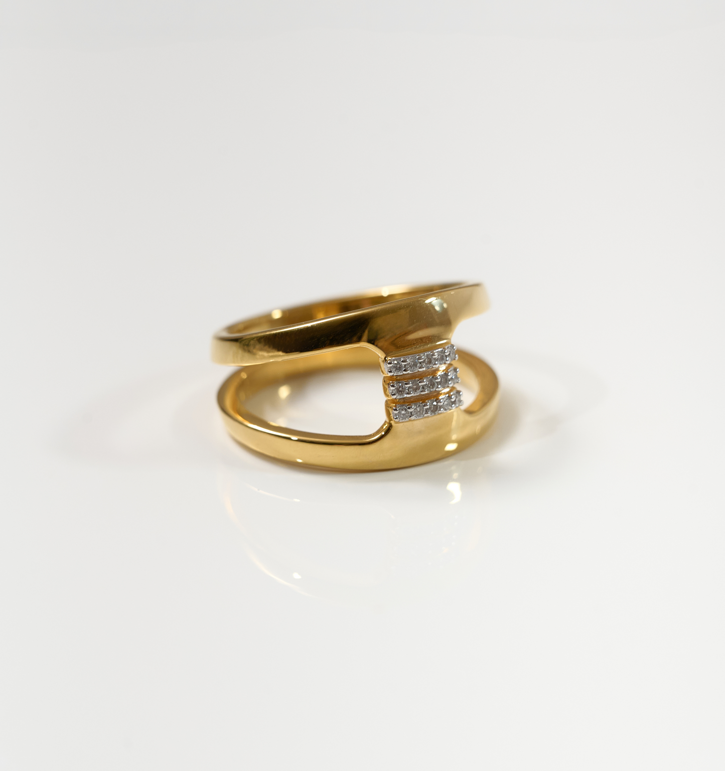 Setu Ring gold with two arcs linked by white topaz bridge symbolizing clarity and connection