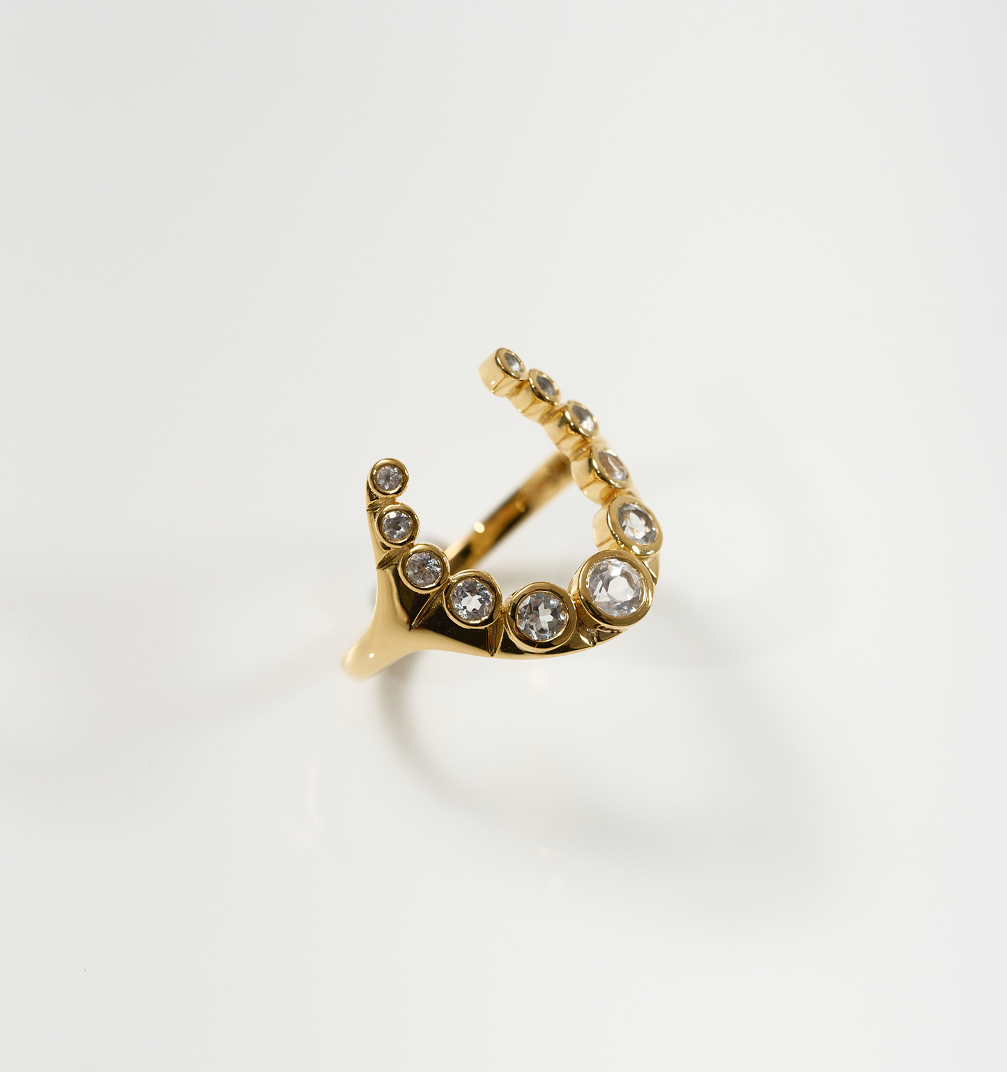 Rakira Ring gold crescent with 11 white topaz stones symbolizing protection and pride