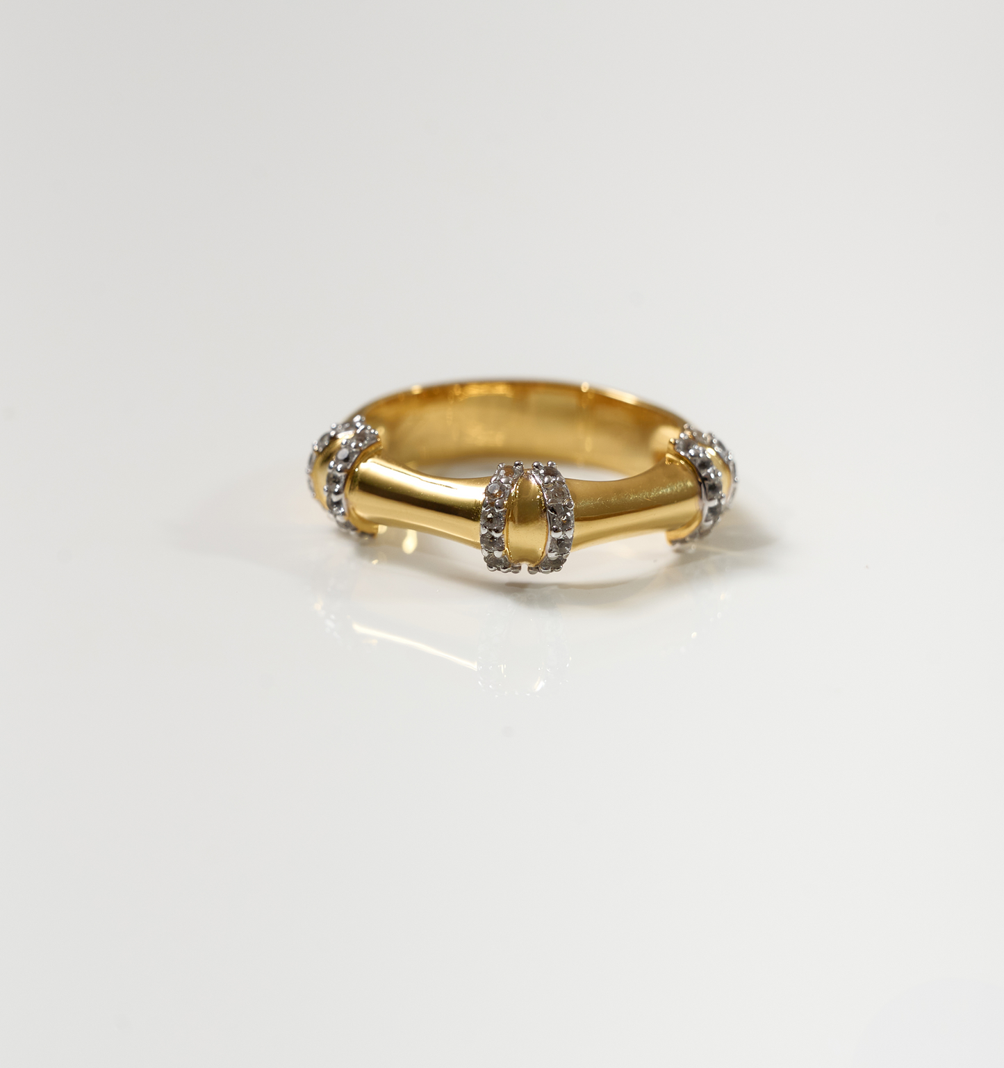 Ansh Ring gold with white topaz accents inspired by bamboo strength and geometric design