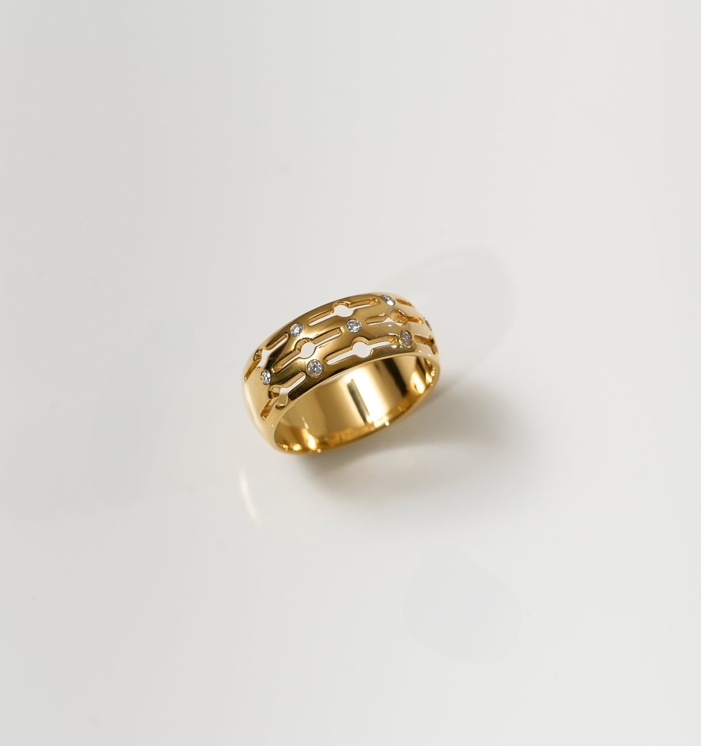Golden Svar Ring with seven lab-grown diamonds on a white background