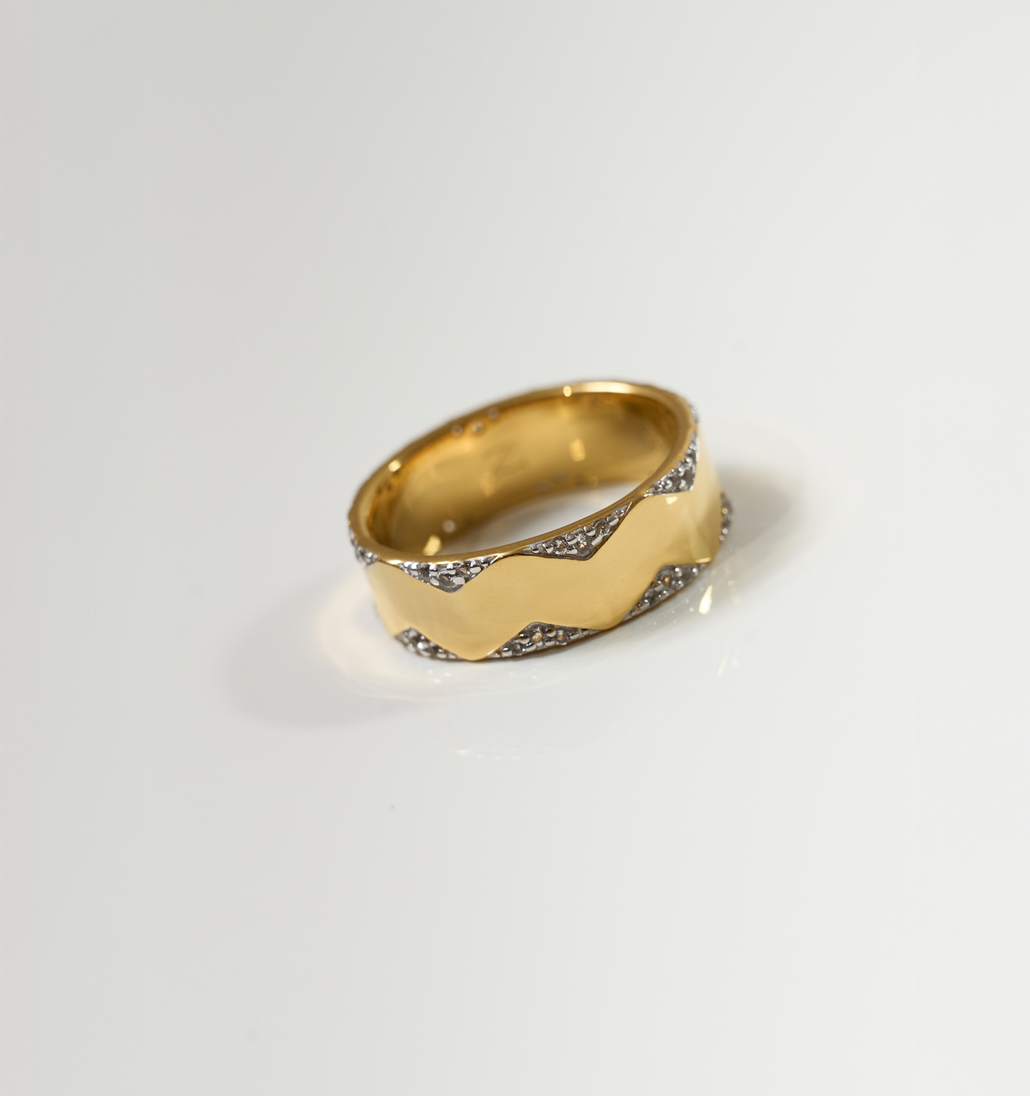 Vedya Ring gold band with sculpted curves and white topaz detailing on edges
