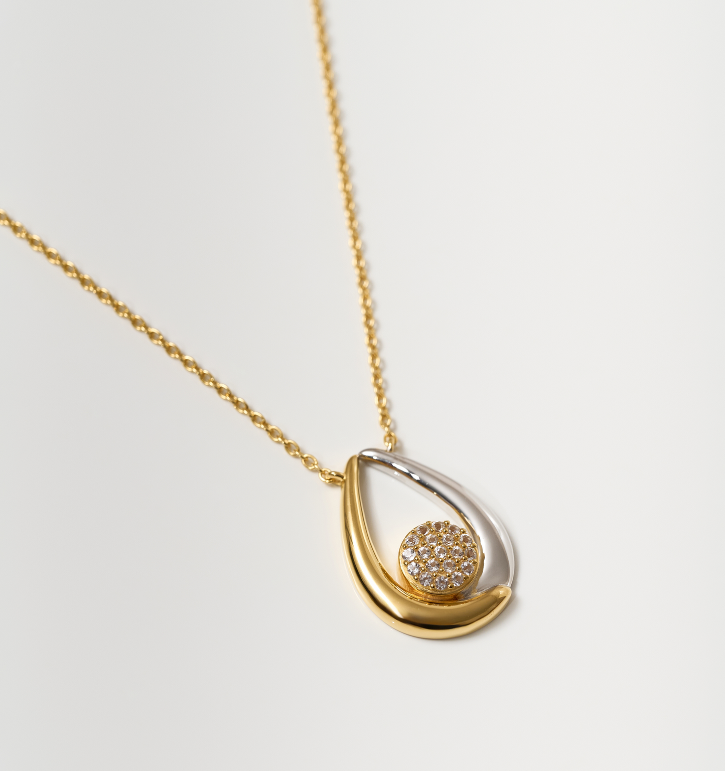 Antara Necklace with gold and silver arcs and white topaz cluster pendant on gold chain