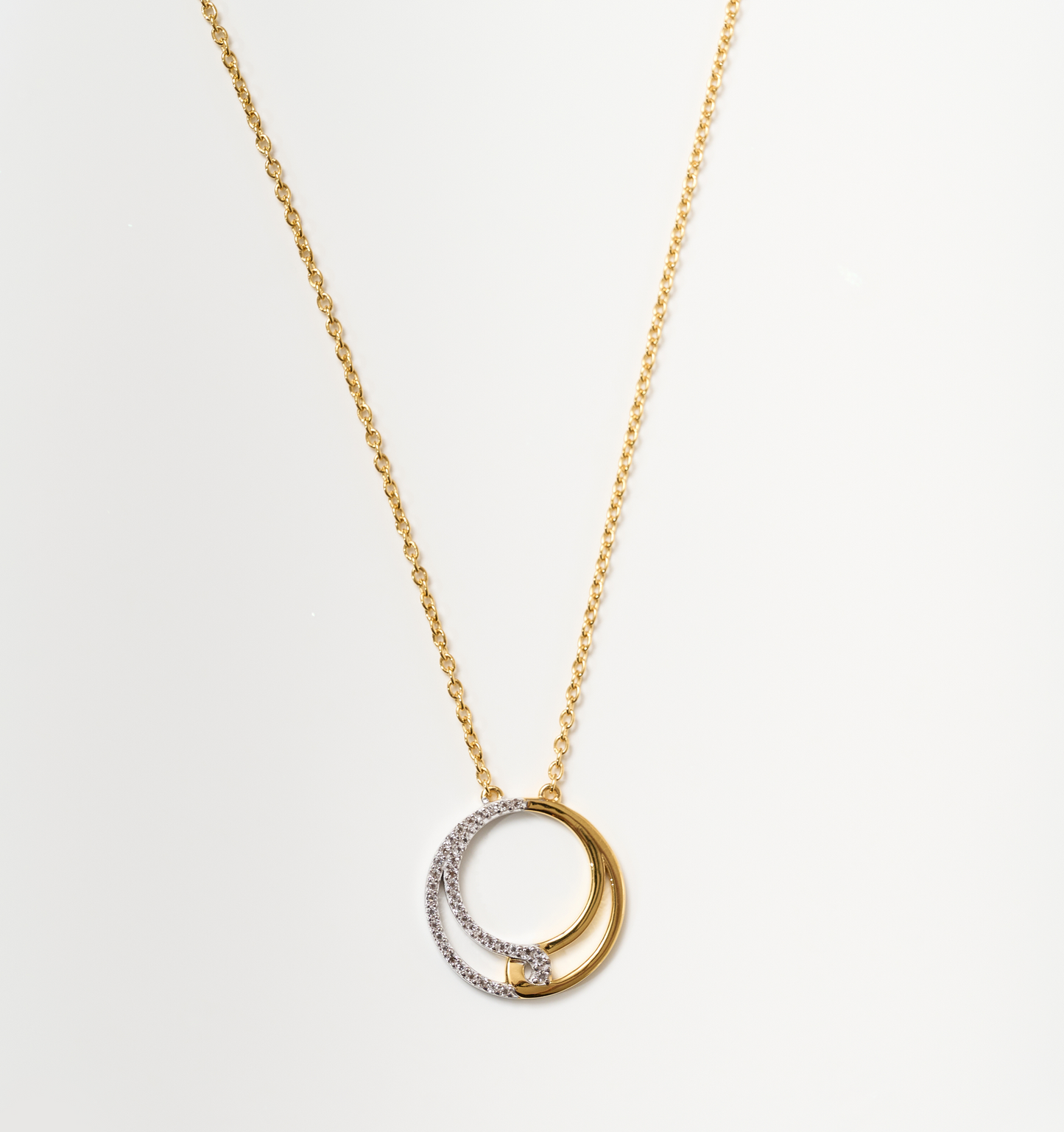 Nayra Necklace gold chain with intertwined silver and gold circles pendant symbolizing unity and strength