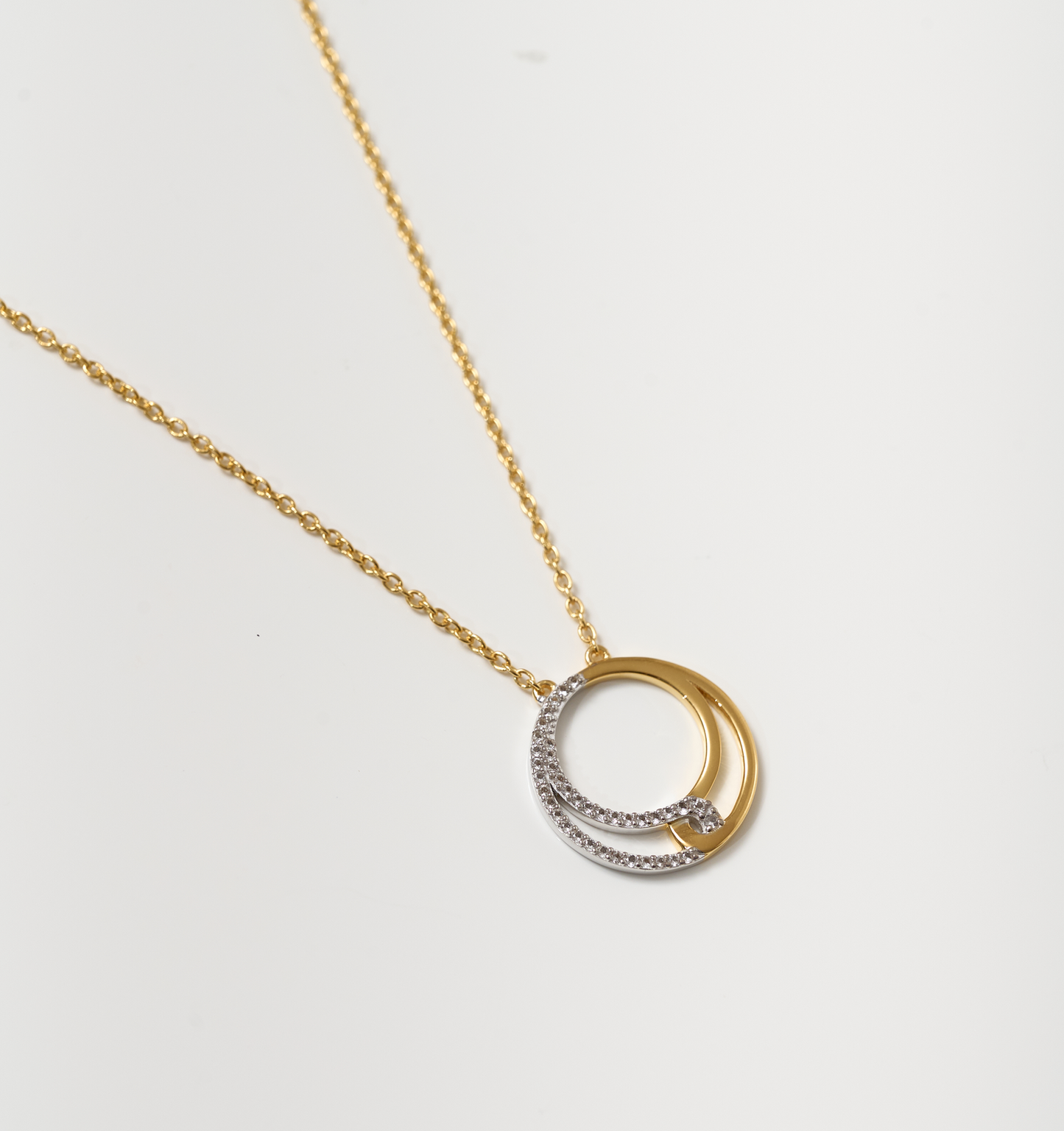 Elegant Nayra Necklace with interlocking gold and diamond-studded circles on a delicate chain