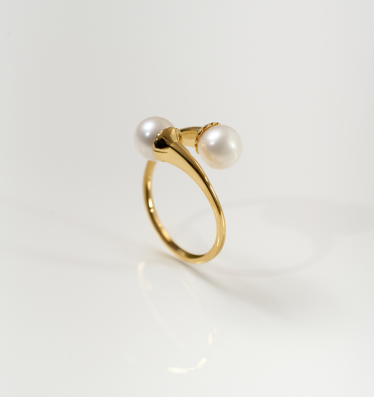 YugYagn Ring with two pearls on gold band symbolizing love and time.