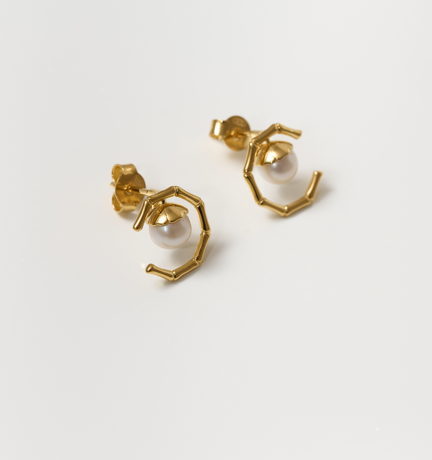 Kavach Earrings gold bamboo-inspired design with single pearl studs