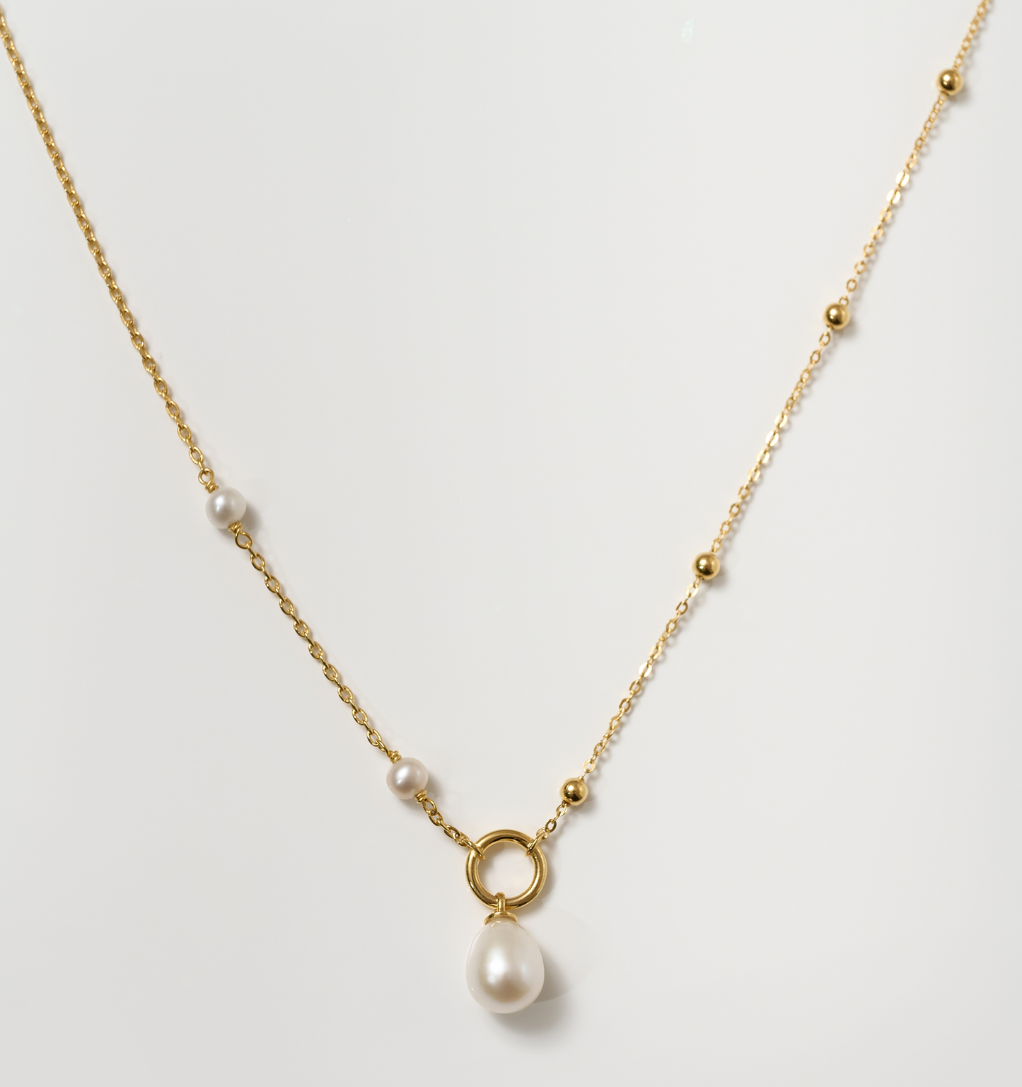 Argha Necklace with pearl pendant and gold chain featuring delicate gold beads