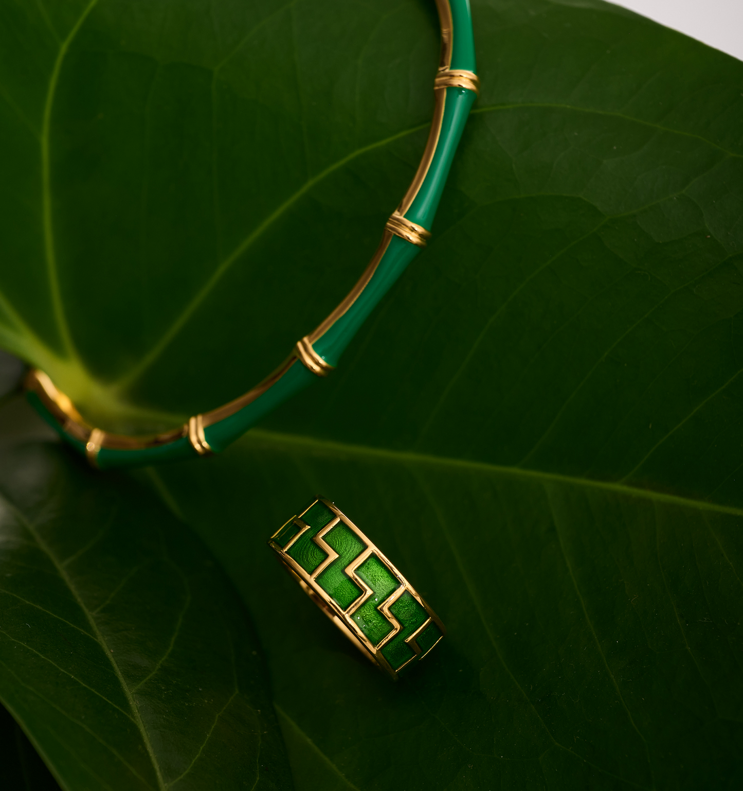Arohi Ring gold and green geometric design on large green leaves