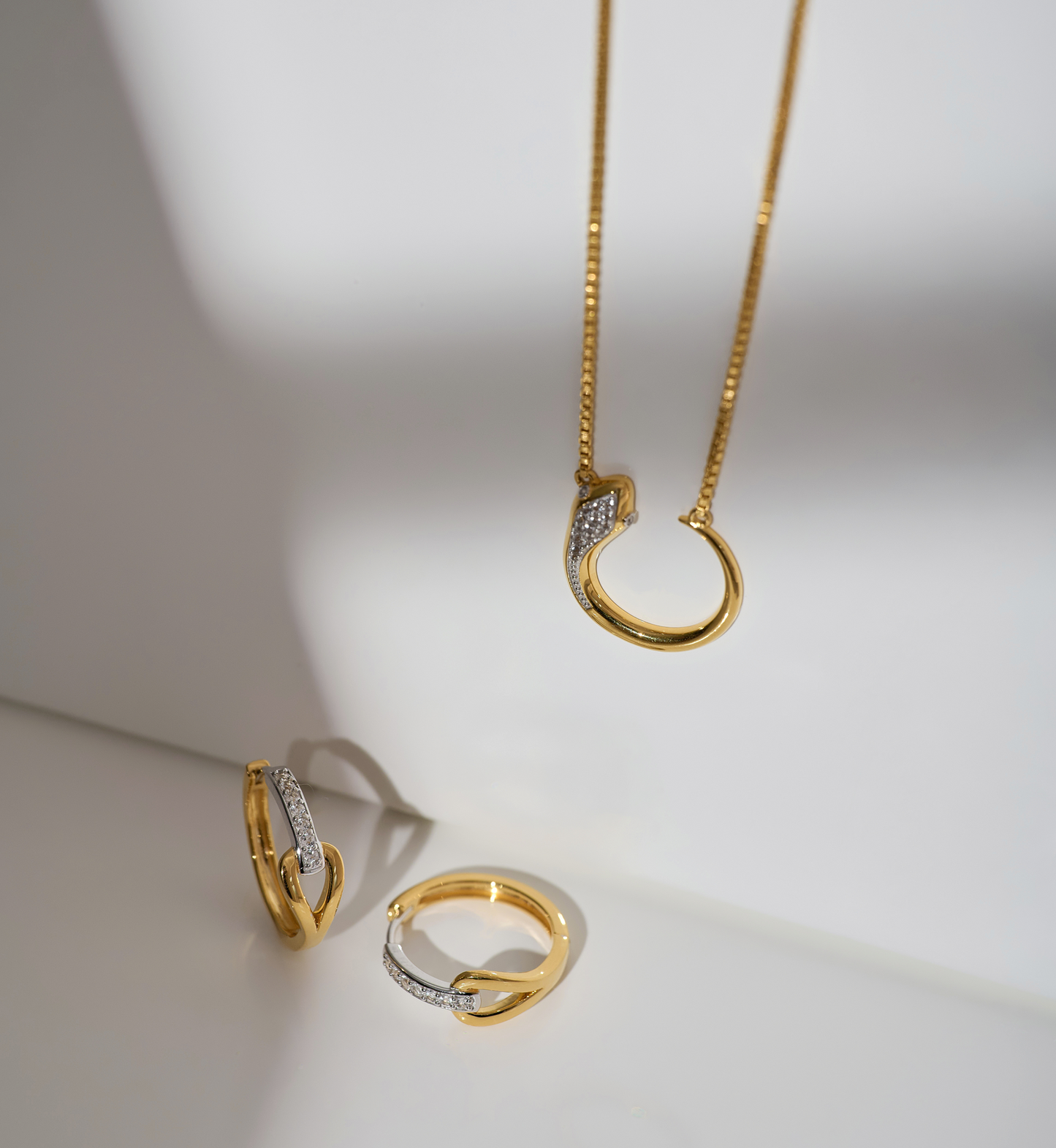 Oroha Necklace gold serpent design with white topaz pendant on chain