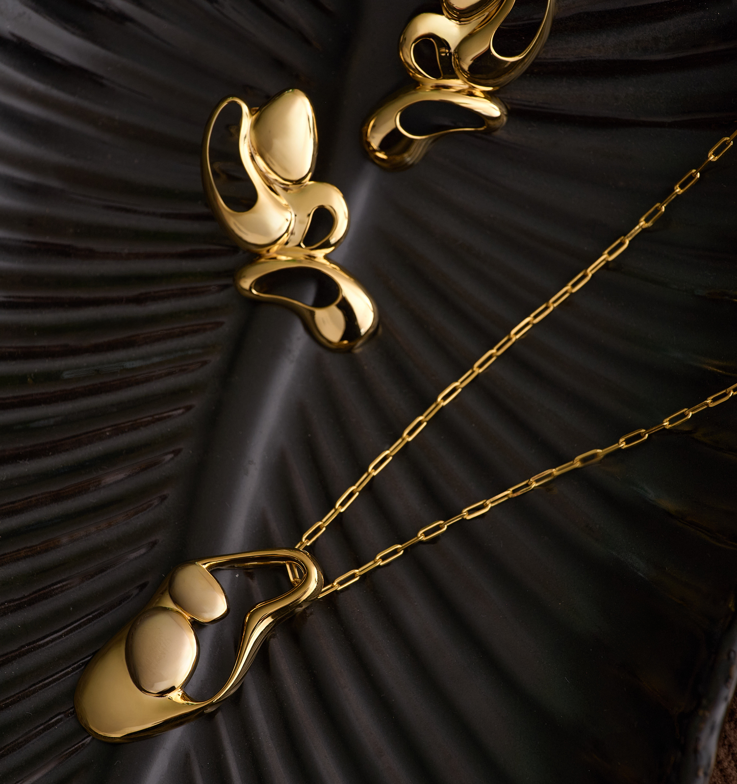 Nutya Earrings radiant gold sculptural fluid feminine design capturing dancer's movement