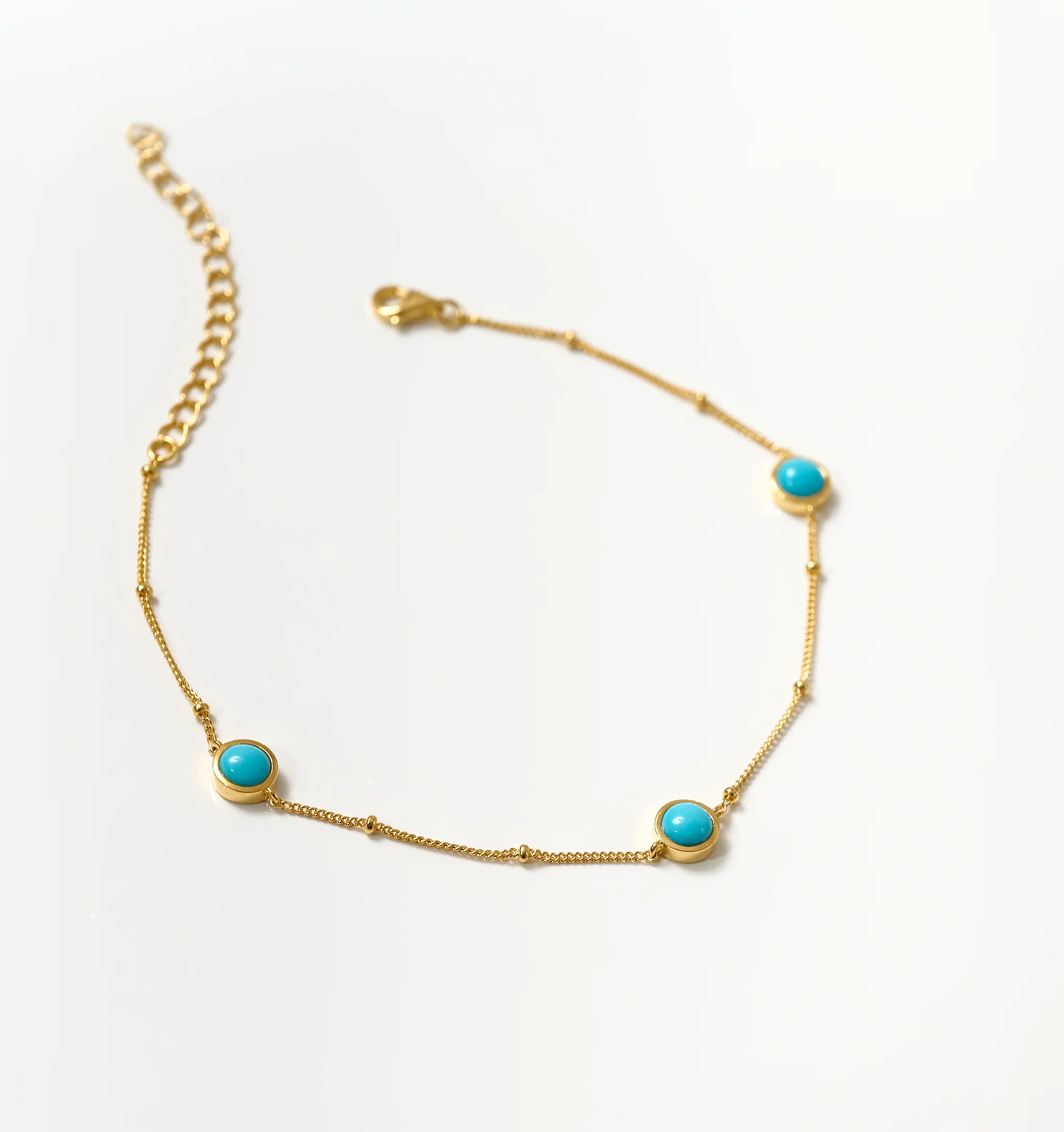 Nilaaya Bracelet delicate gold chain with three turquoise stones on white background