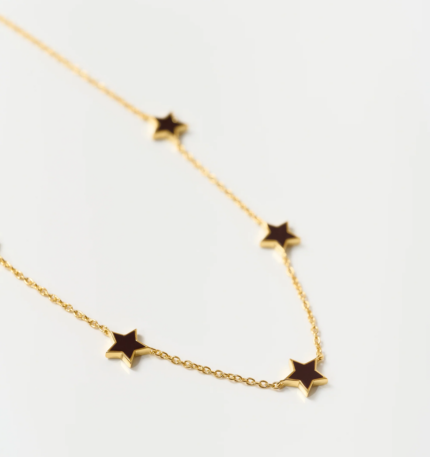 Noctra Necklace gold chain with star-shaped pendants elegant celestial jewelry