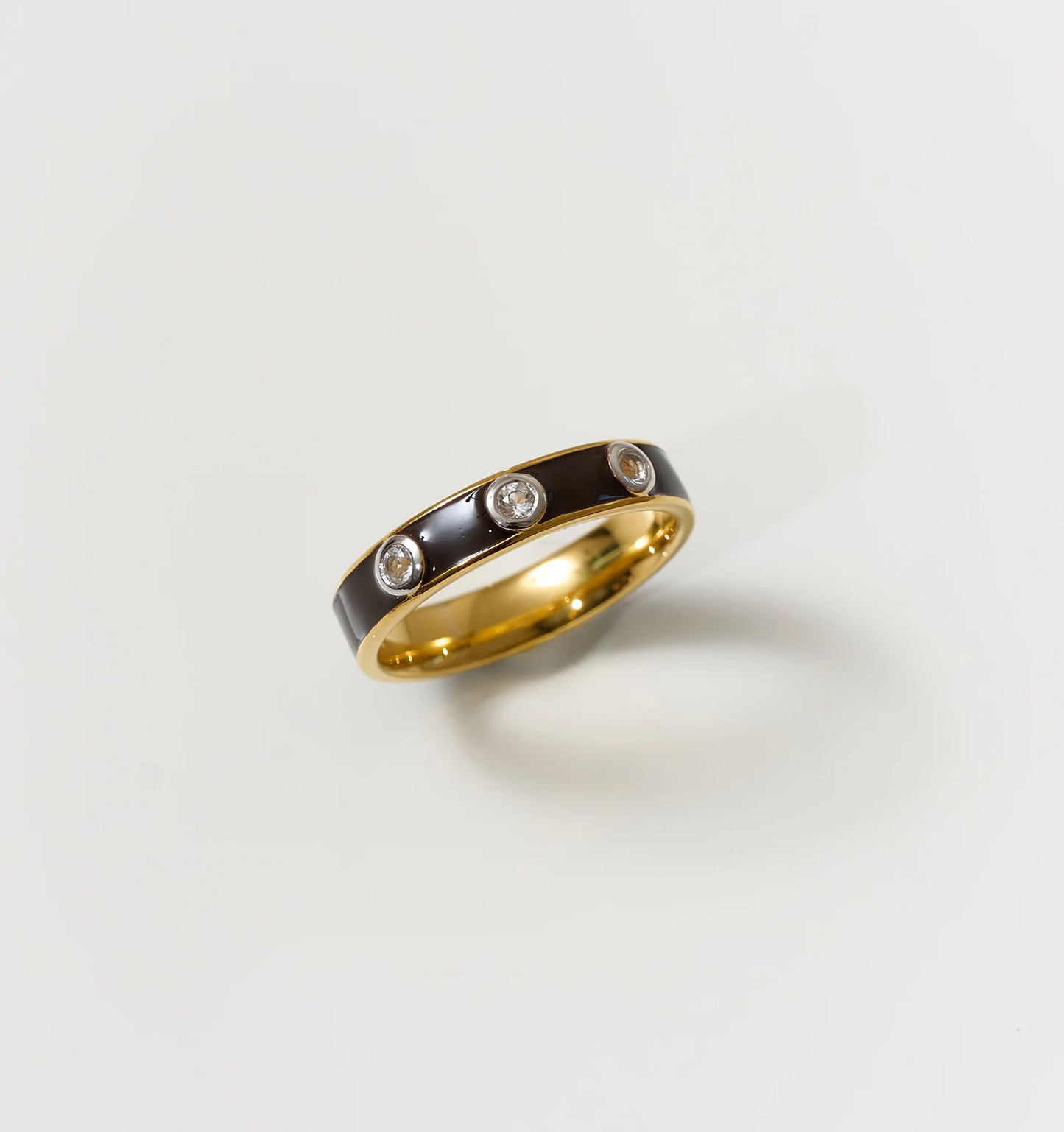 Trikaala Ring gold band with black enamel and white stones detailing