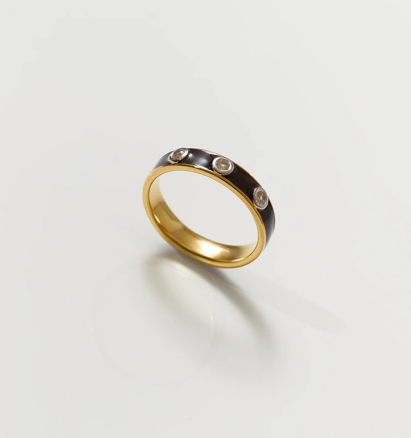 Trikaala Ring gold band with black inlay and white stones reflecting time's cycle and lessons