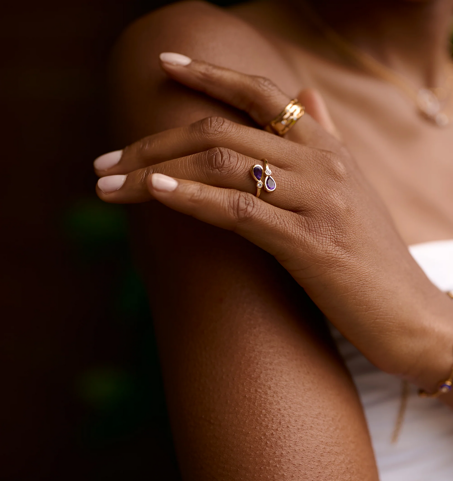 Nimira Ring with twin amethysts and white topaz on hand