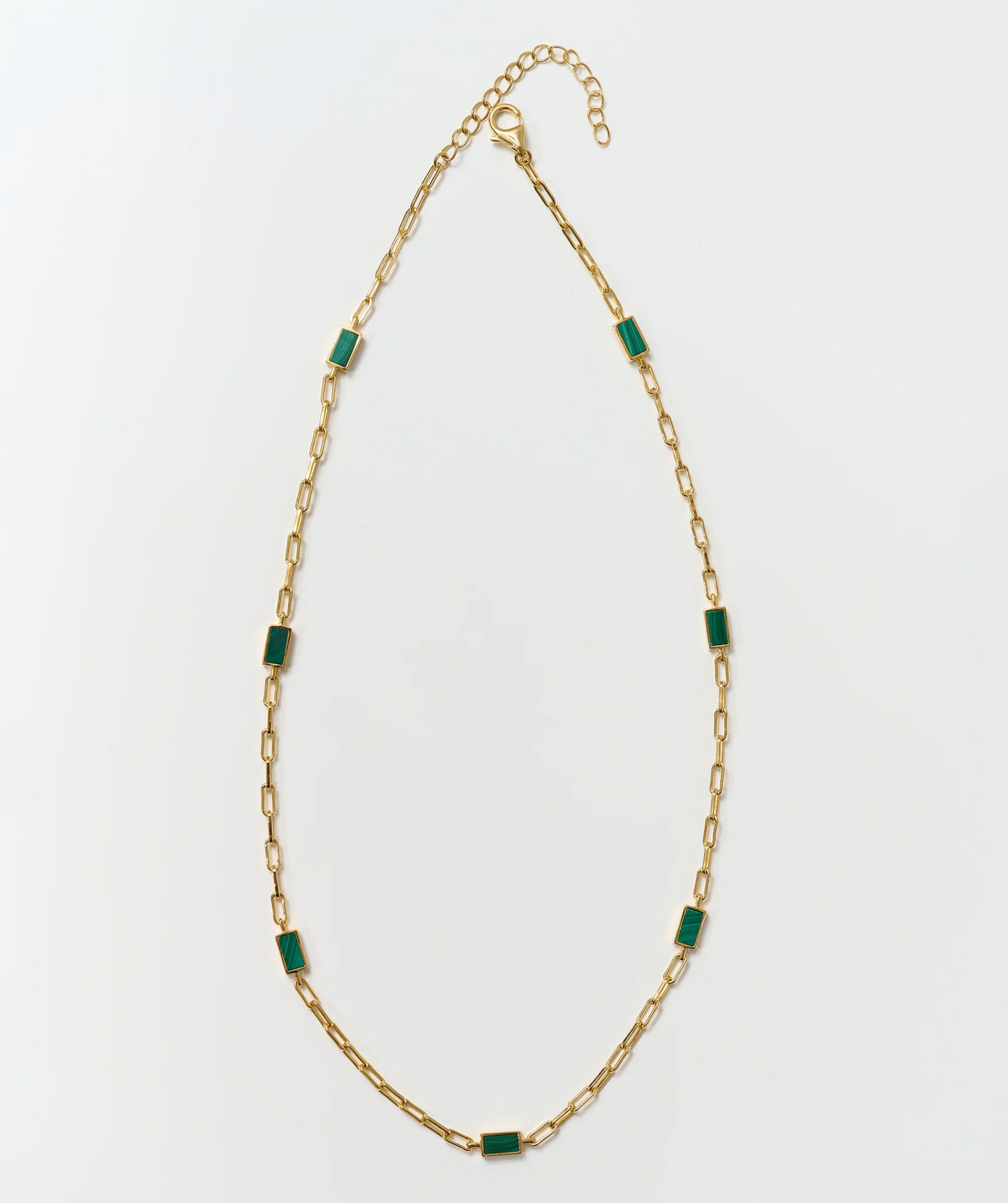 Tarang Necklace with seven green malachite stones on a gold chain balancing heart chakra energy