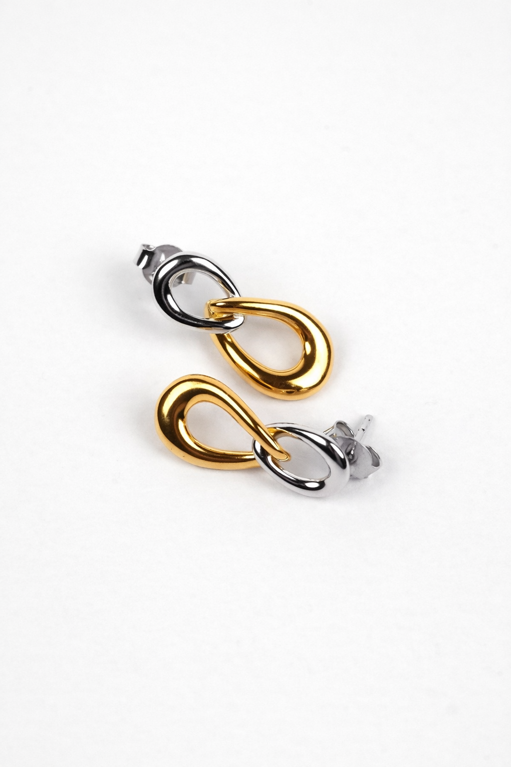 Sama Earring with two interlinked contrasting forms showcasing balanced, modern sculptural design