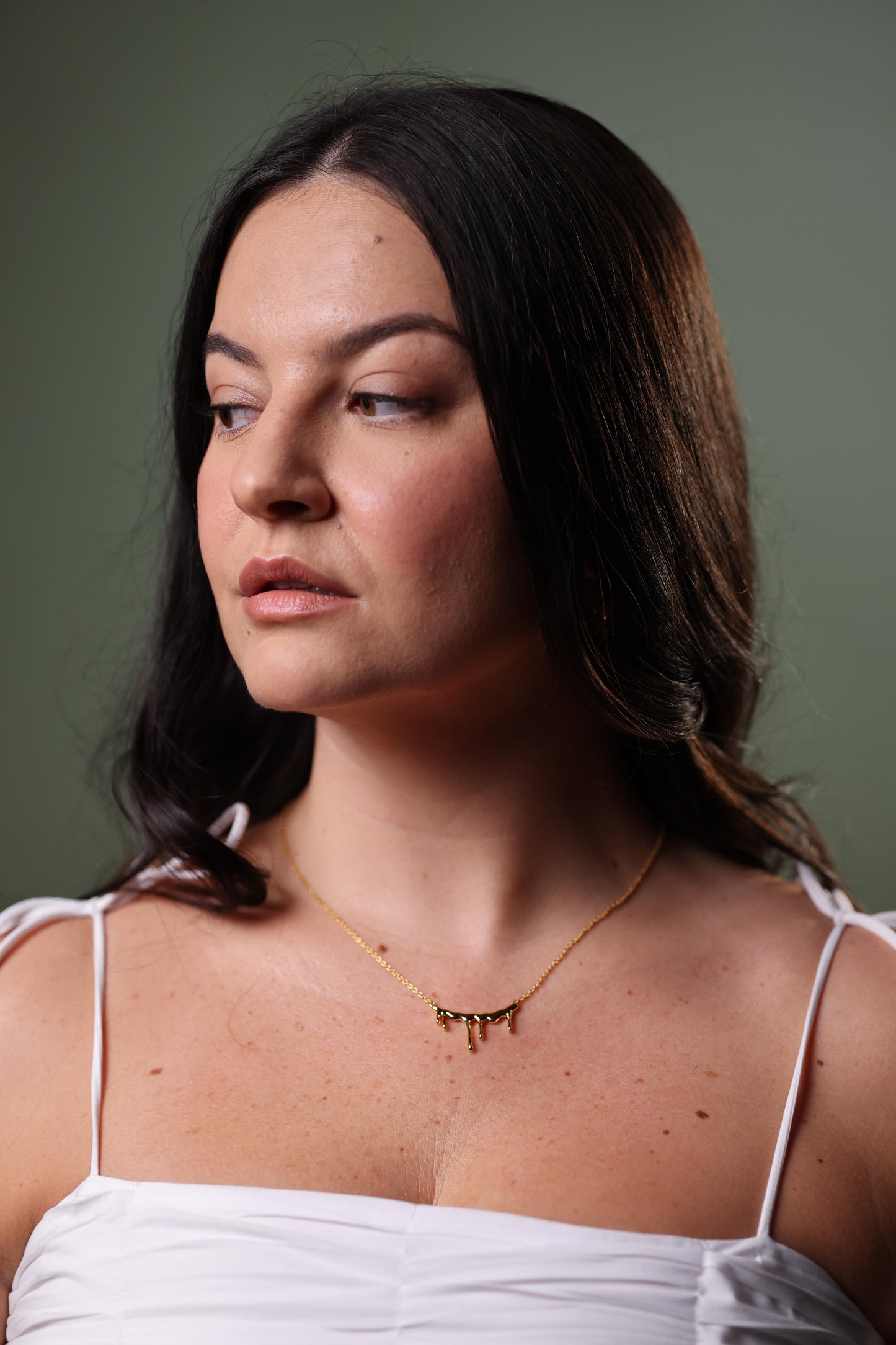 Jharna Necklace with curved neckline and flowing suspended drops in modern design