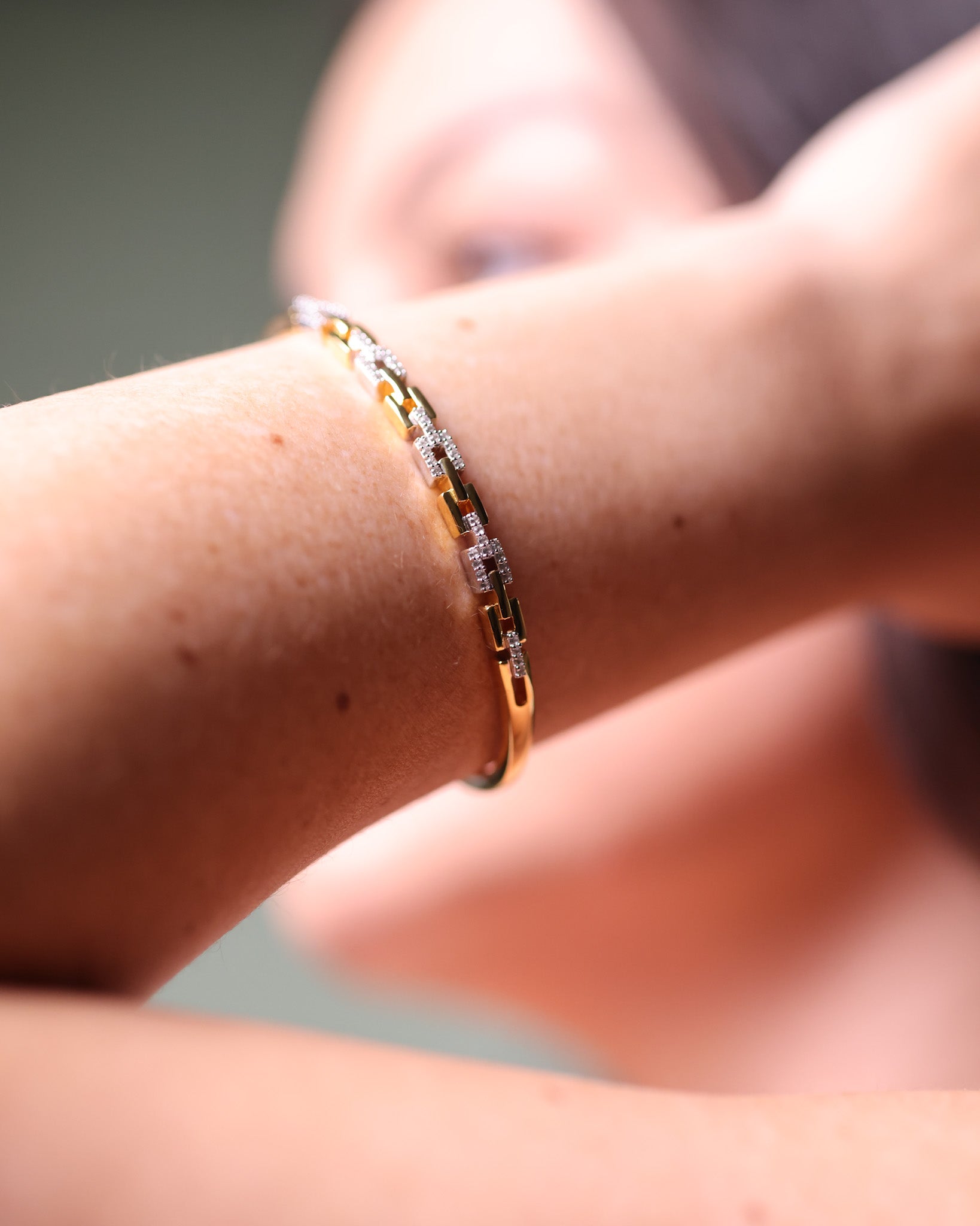 Noura Cuff two-tone gold and silver linked bracelet with 52 sparkling stones, modern open bangle design