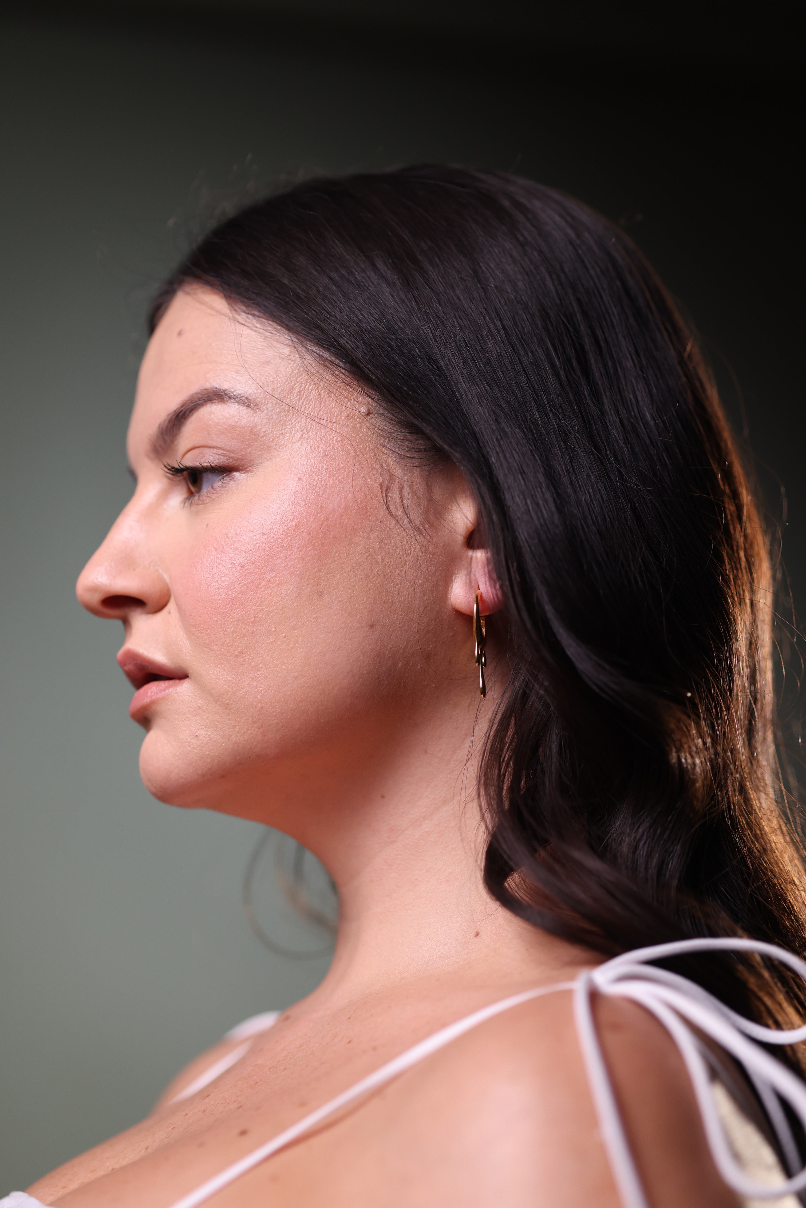 Vari Earring with wave-like, fluid open silhouette showcasing organic and expressive design