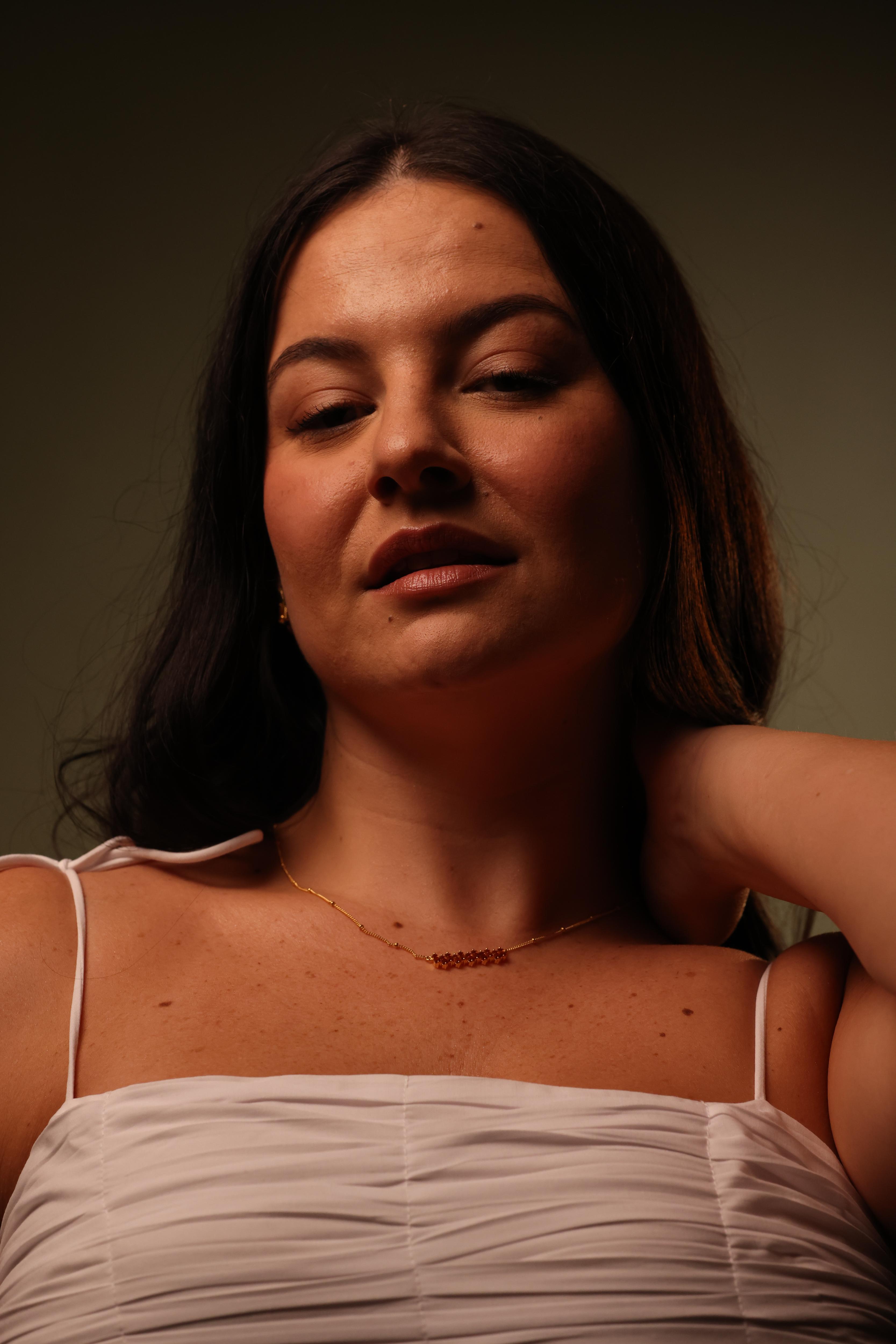 Minimal Sutra Necklace close to skin complementing statement rings and layered styling