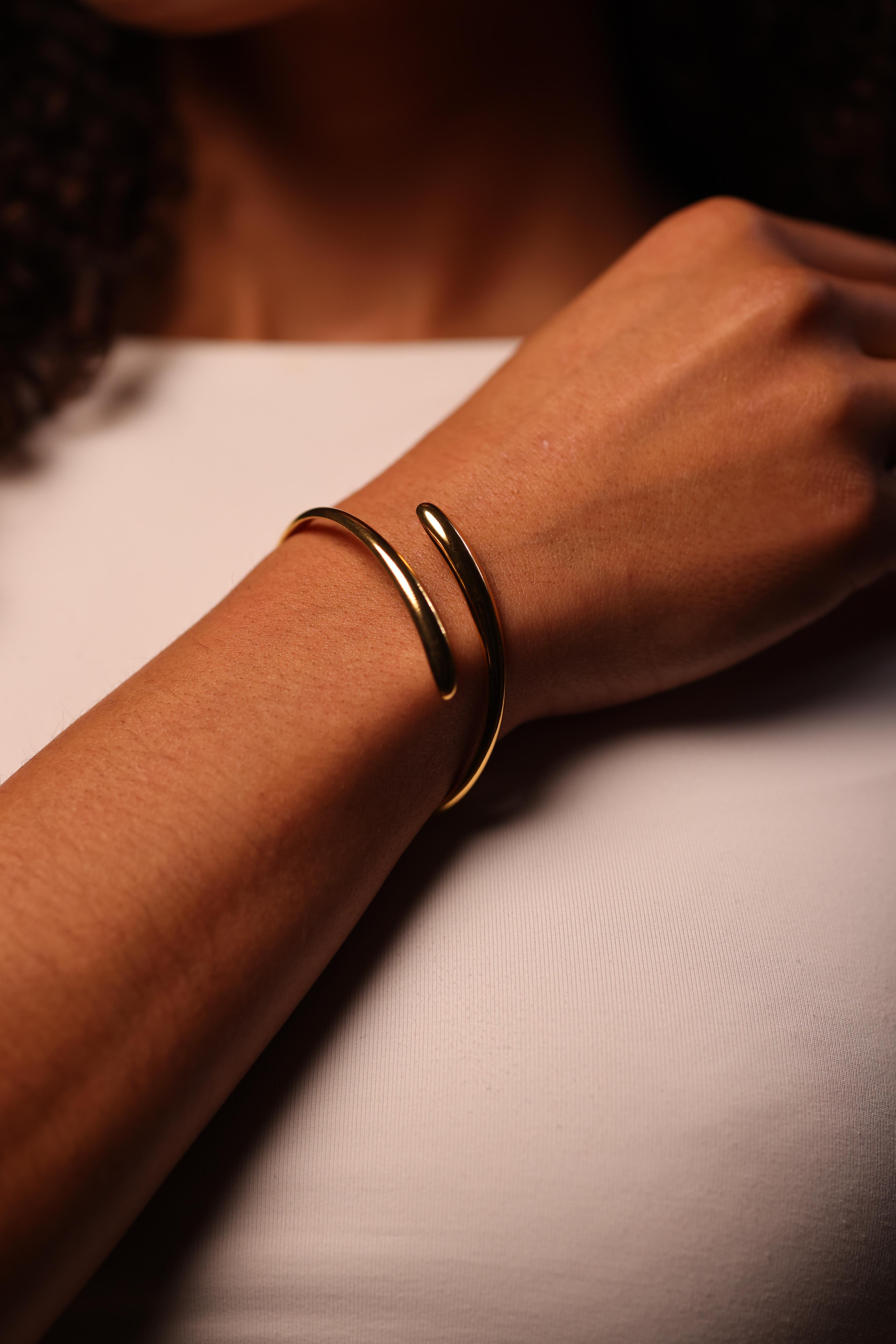 Avart Cuff sculptural spiral open-ended wrist cuff with fluid continuous curve
