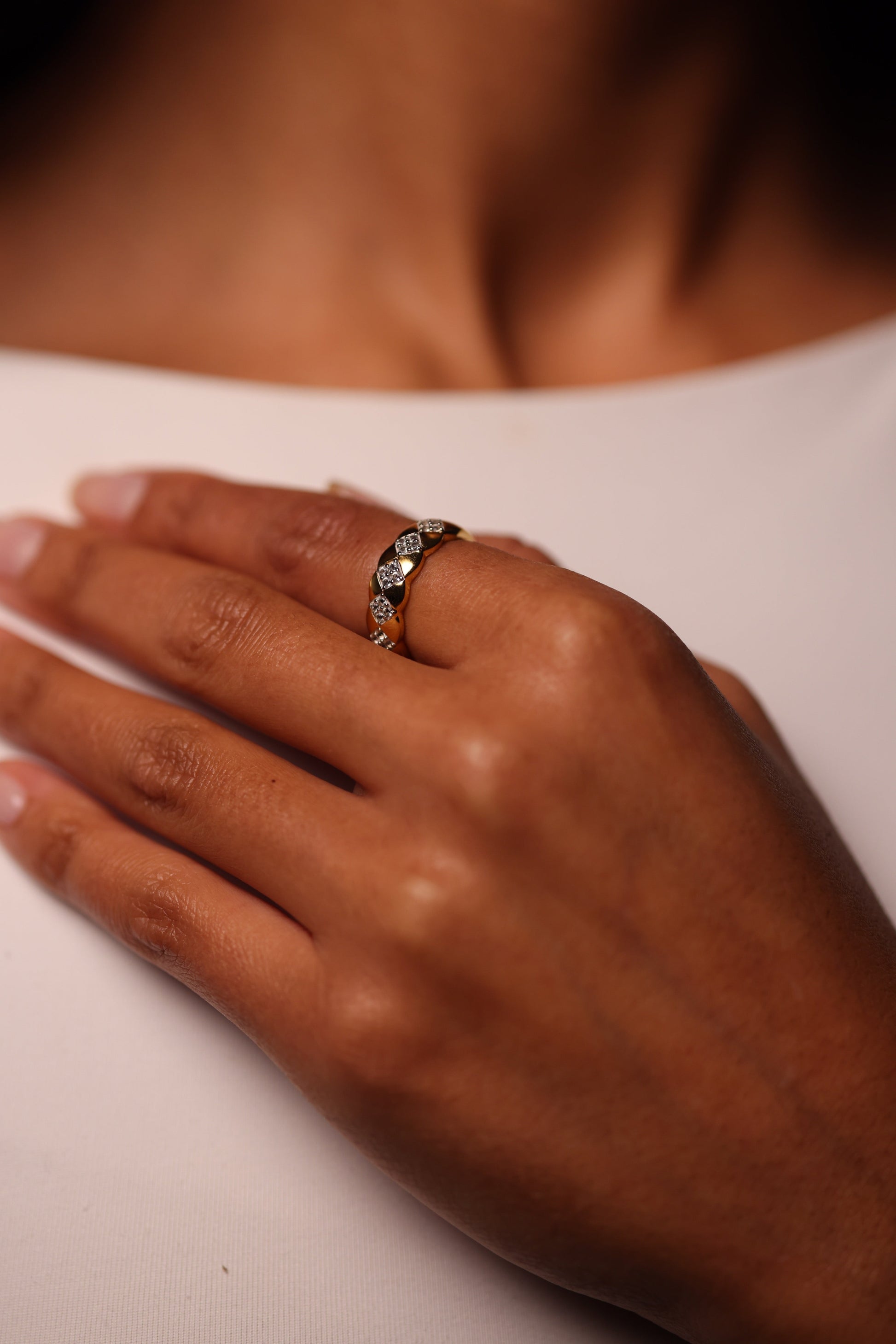 Taal Ring with white topaz stones in a modern gold band showcasing balanced design and rhythm