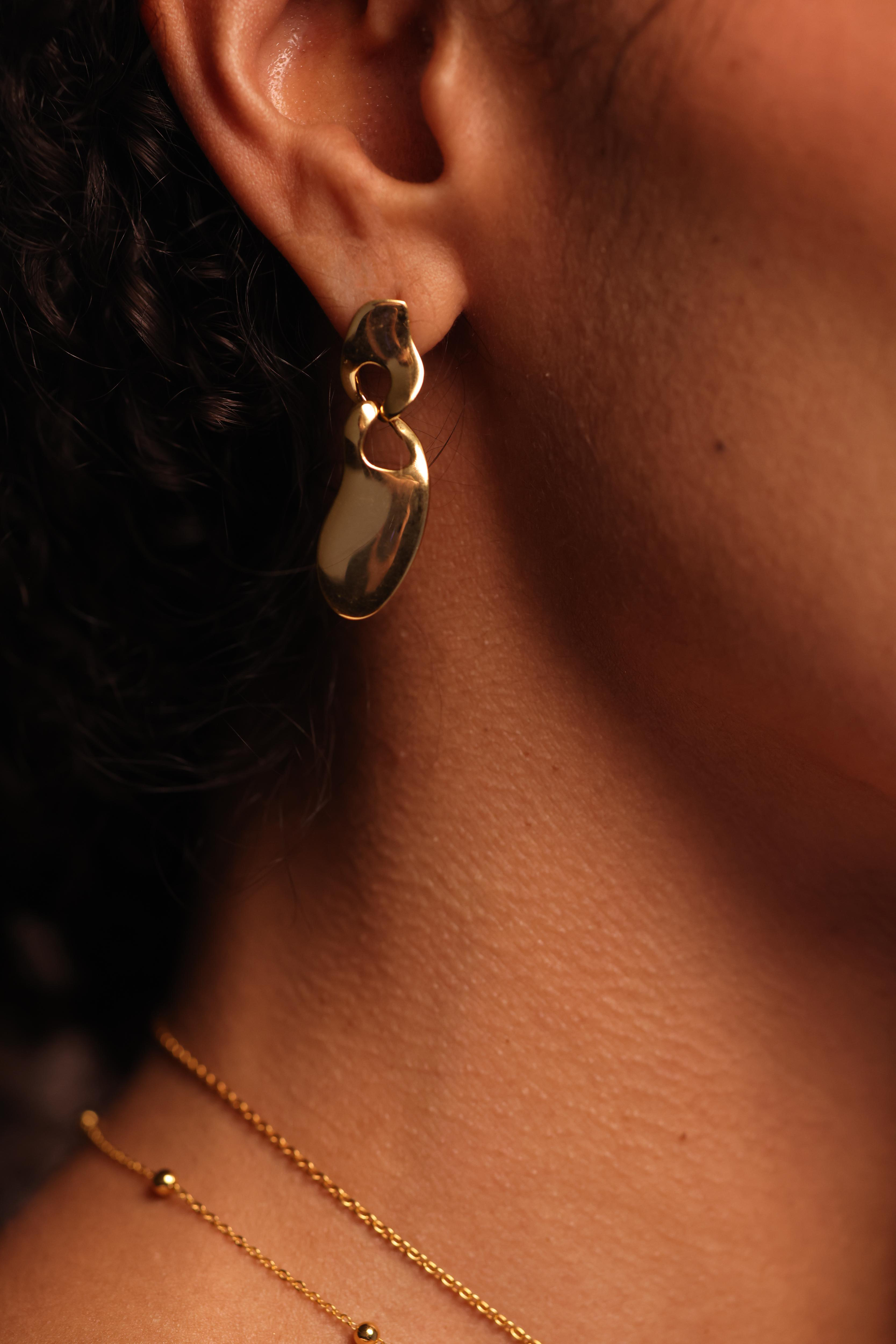 Pravah Earring with organic flowing shapes and elongated silhouette showcasing gentle movement and natural rhythm